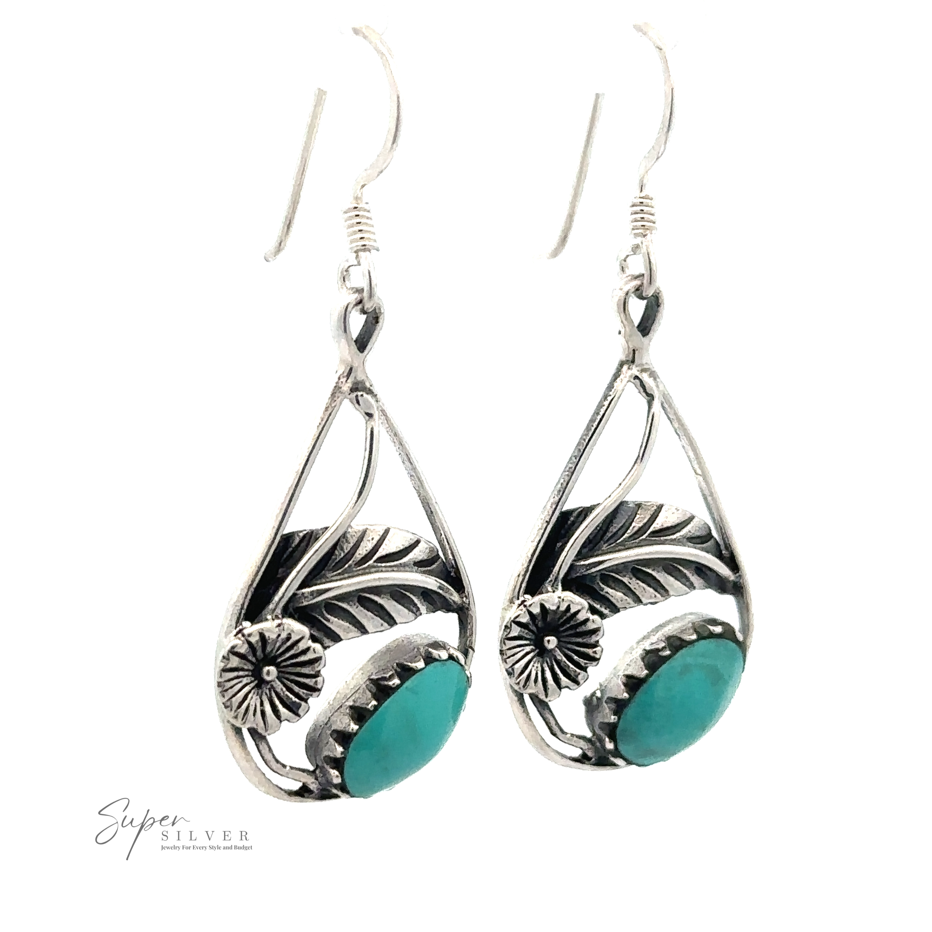 A pair of Inlaid Teardrop Earrings With Floral Setting with intricate floral designs and turquoise stones, displayed against a white background. The earrings have hook-style clasps.