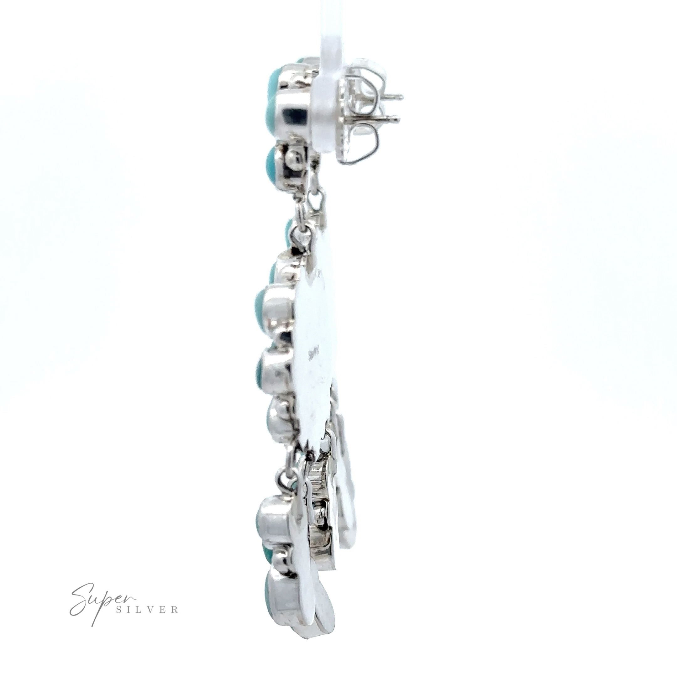 A silver charm bracelet with various pendants including a heart and a bird, showcasing Native American craftsmanship, displayed against a white background with "super silver" text.