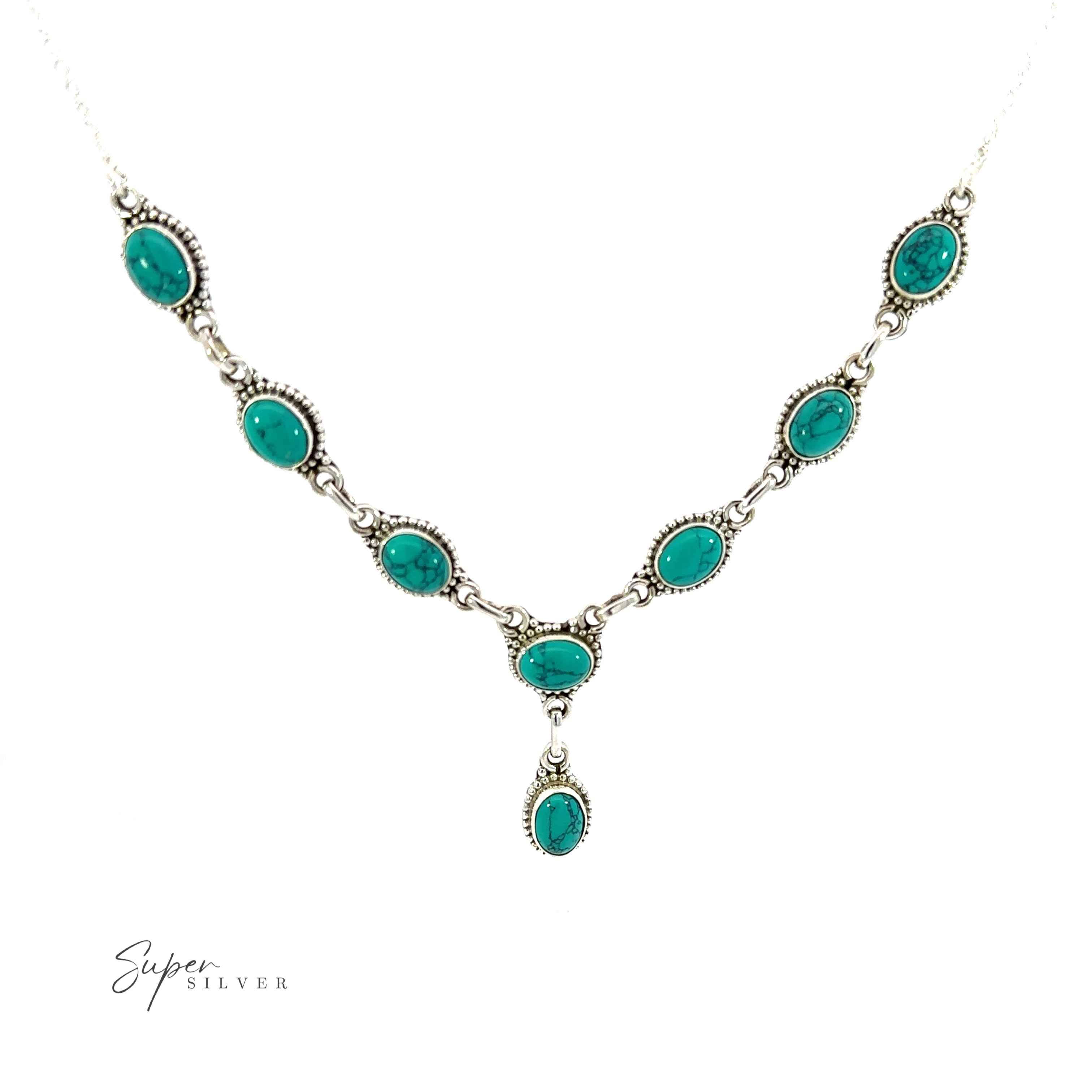 This Gemstone Y-Necklace with Beaded Border showcases beautiful turquoise gemstones on a white background. With its stunning Y-shaped design, this necklace is sure to make a lasting impression and enhance any outfit.