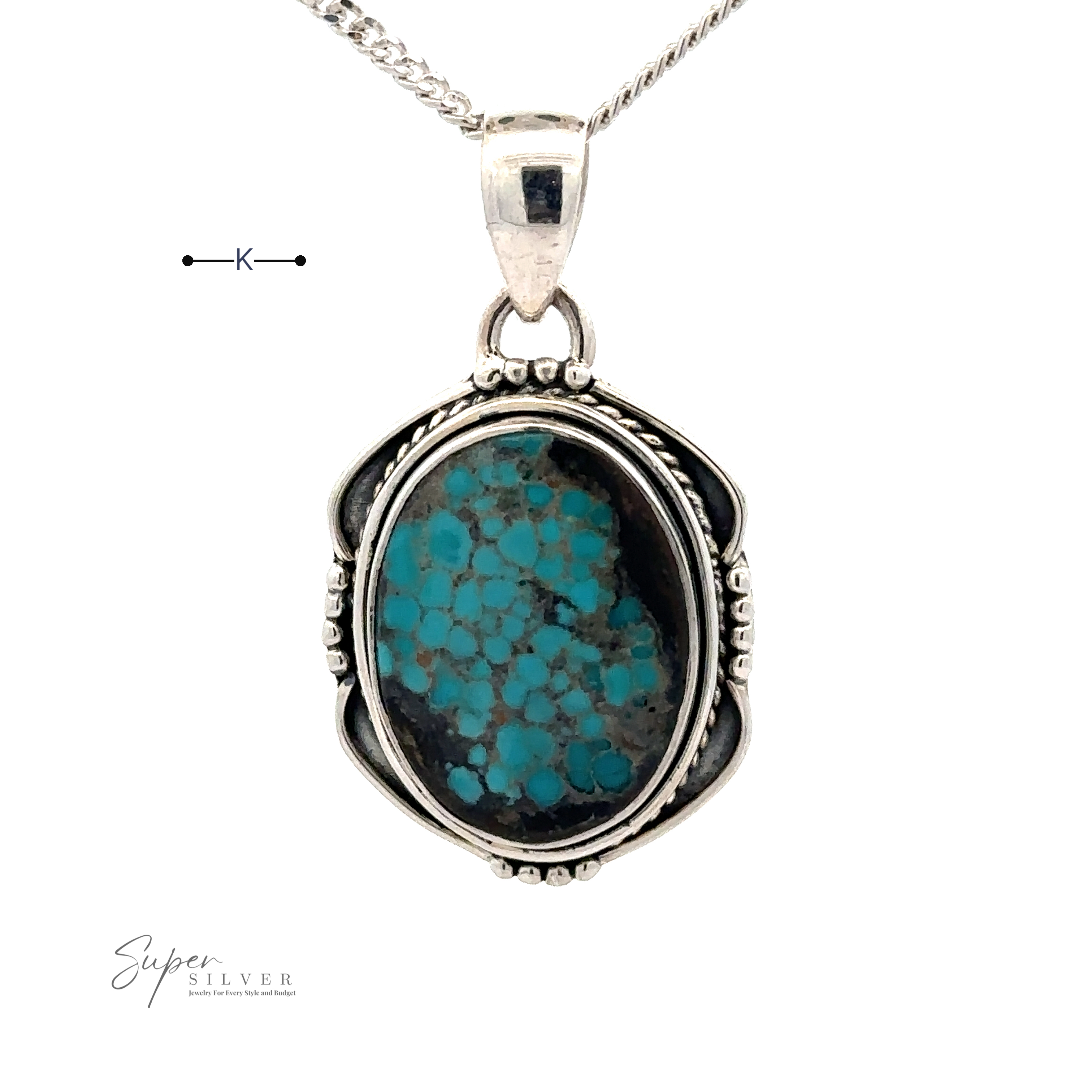 A Natural Turquoise Pendant with an Oval Shield Setting, intricately detailed with handmade silver work, is suspended from a fine silver chain.