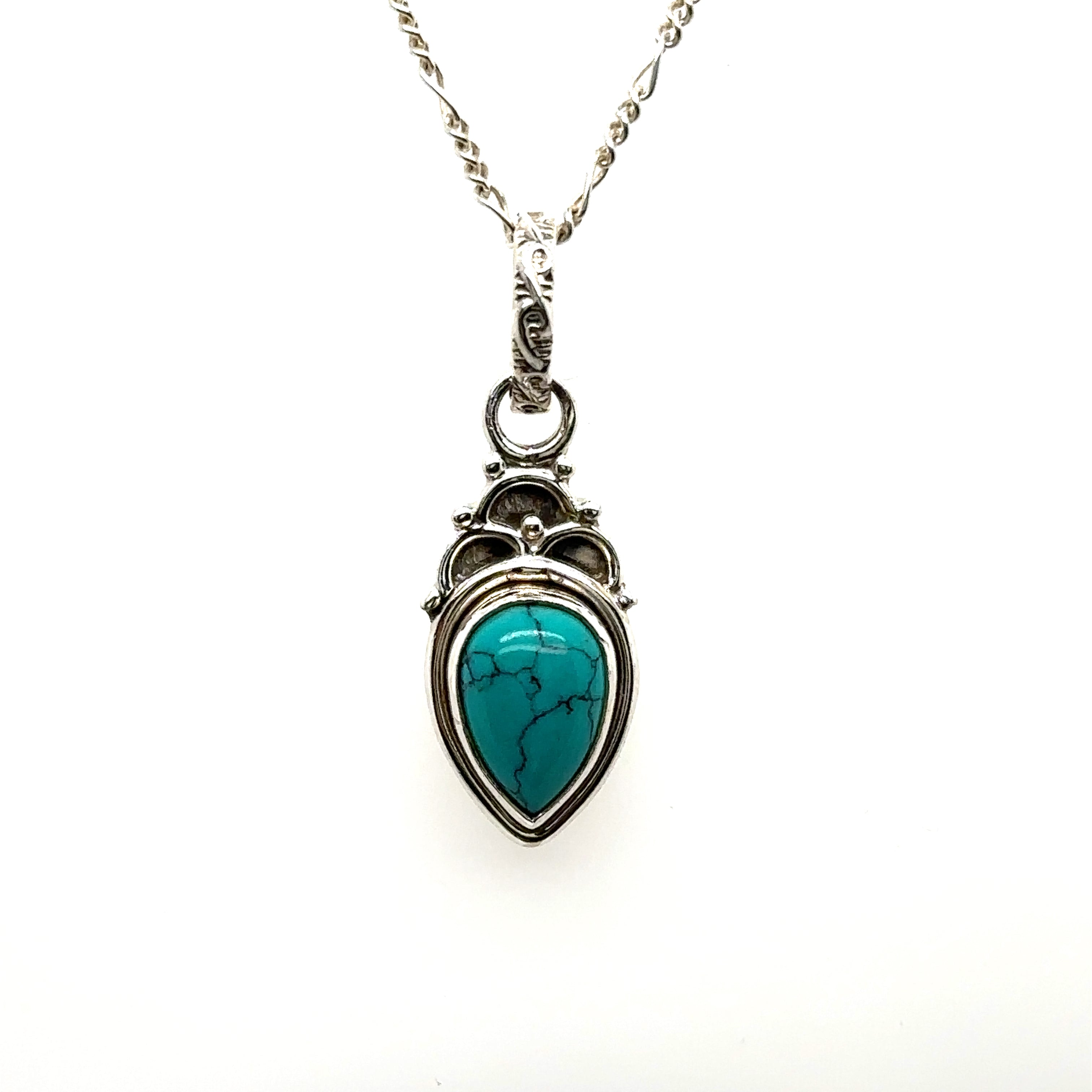 A Dainty Gemstone Teardrop Pendant with a turquoise stone on a silver chain, exuding free-spirited elegance and simplicity.