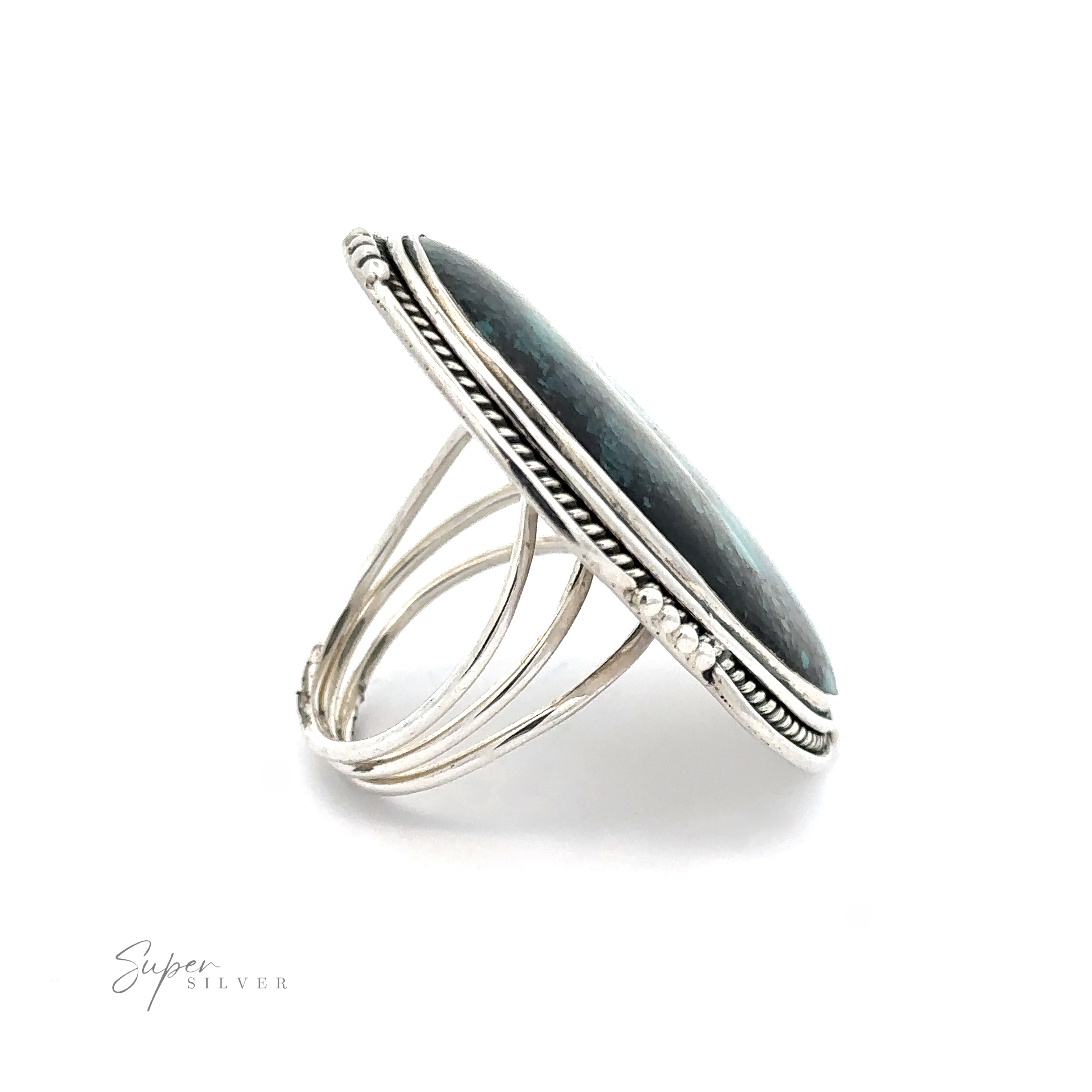 Oval Natural Turquoise Ring With Rope And Ball Border, displayed on a white background. This elegant design showcases a blend of craftsmanship and sophistication.