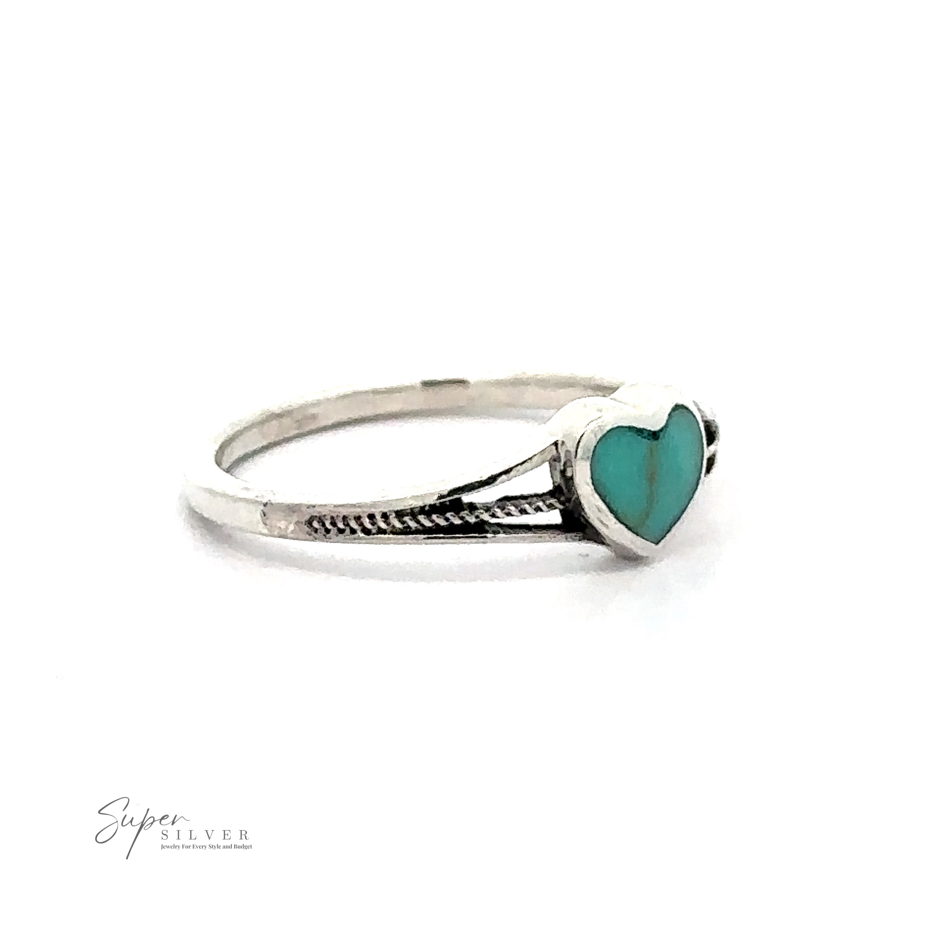 A Small Inlaid Turquoise Heart Ring featuring an adorable turquoise heart-shaped stone. The band includes a subtle, braided design. The image has the "Super Silver" logo in the bottom left corner.