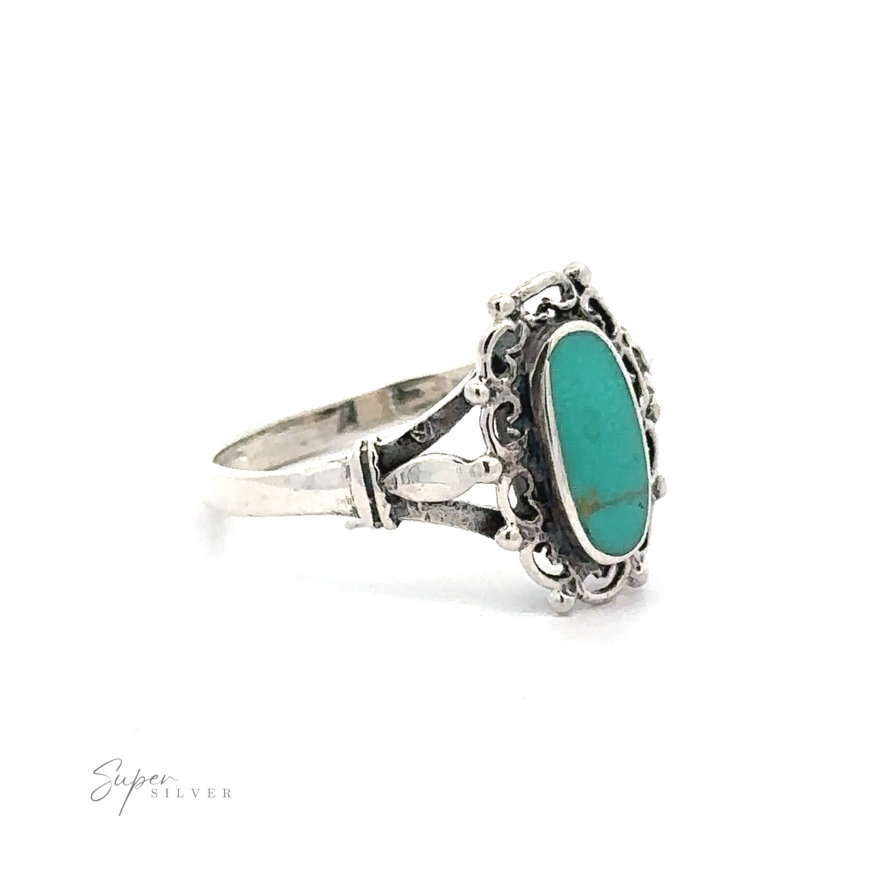 A vintage Inlaid Oval Ring with Filigree Heart Border.