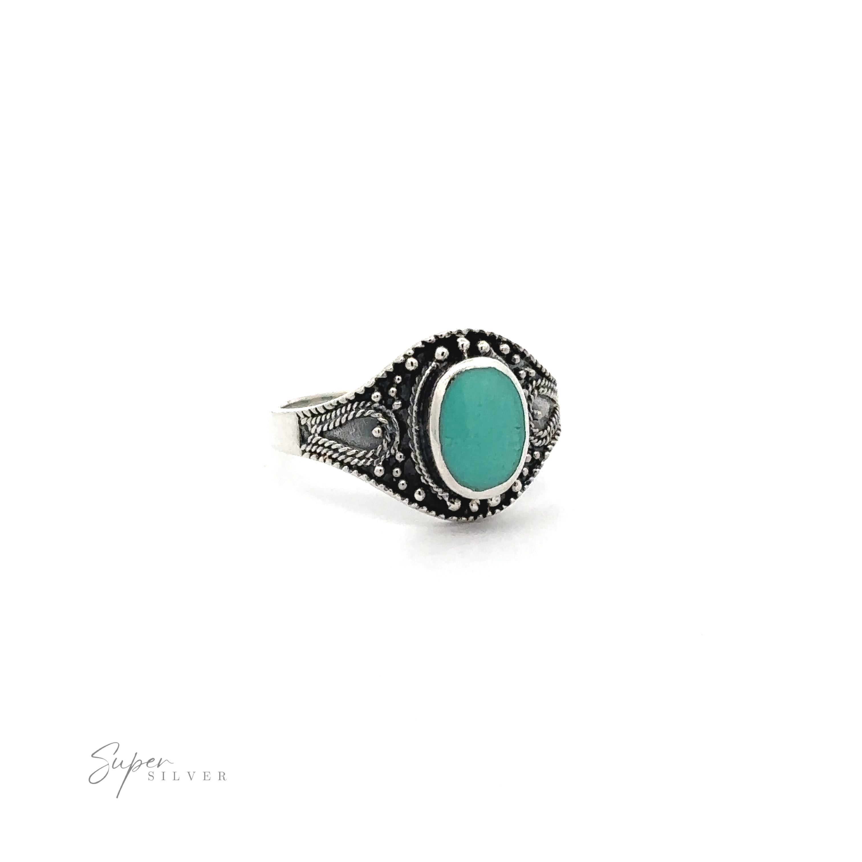 A vintage-chic silver Vintage Style Oval Shield Ring with Inlaid Stones, sprucing up any outfit with its oxidized detailing.