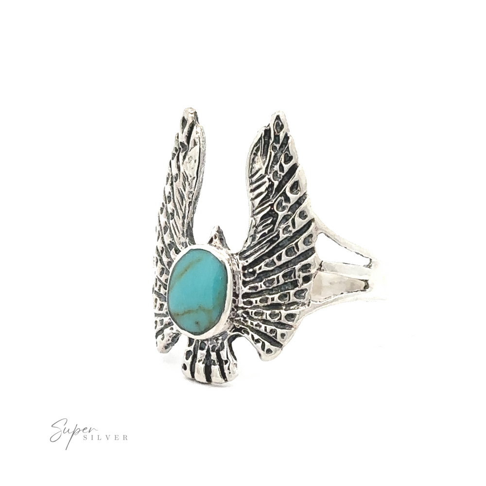 
                  
                    Inlaid Stone Ring with Eagle Wings featuring a central turquoise stone, displayed on a white background.
                  
                
