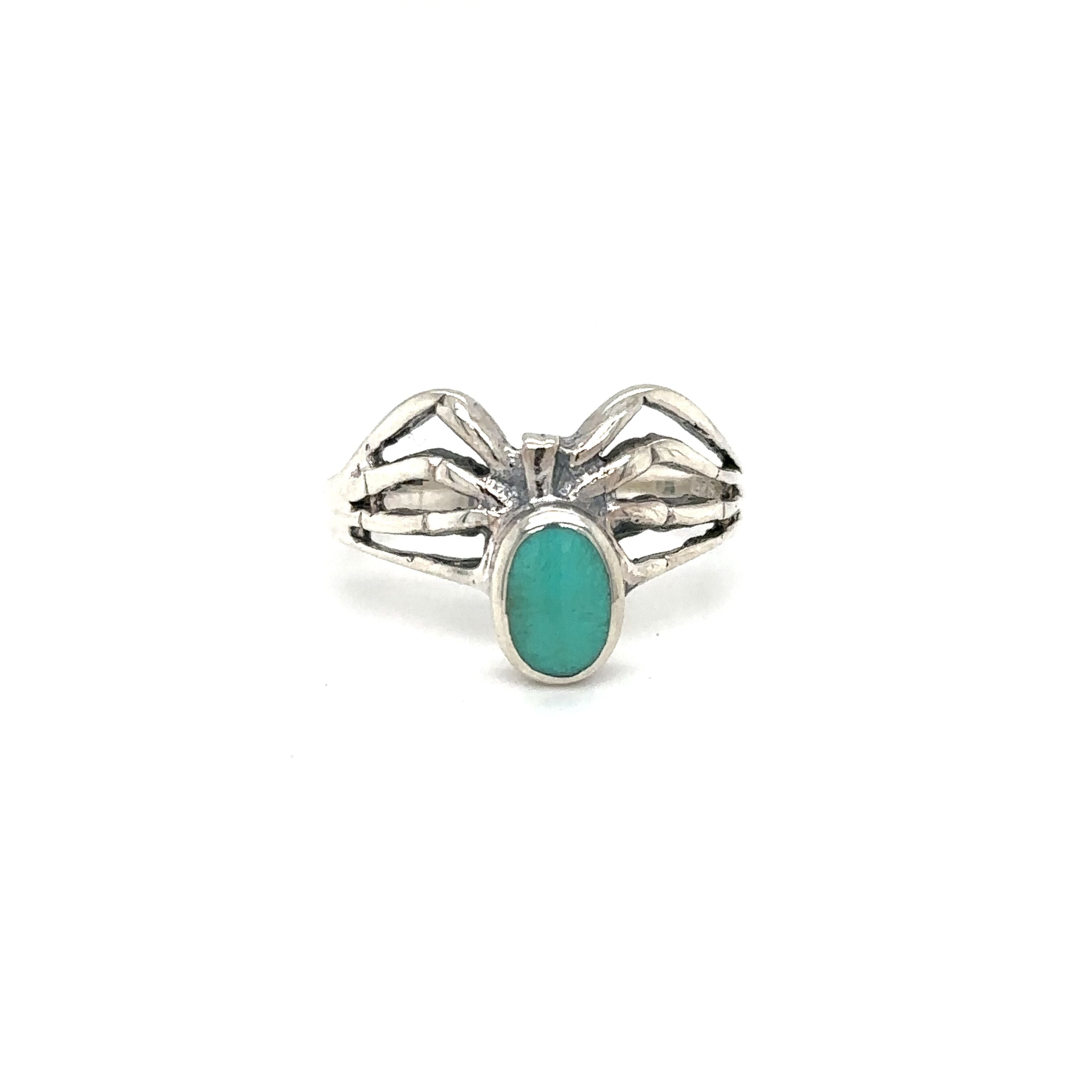A mystical Inlay Stone Spider Ring adorned with a turquoise stone by Super Silver.