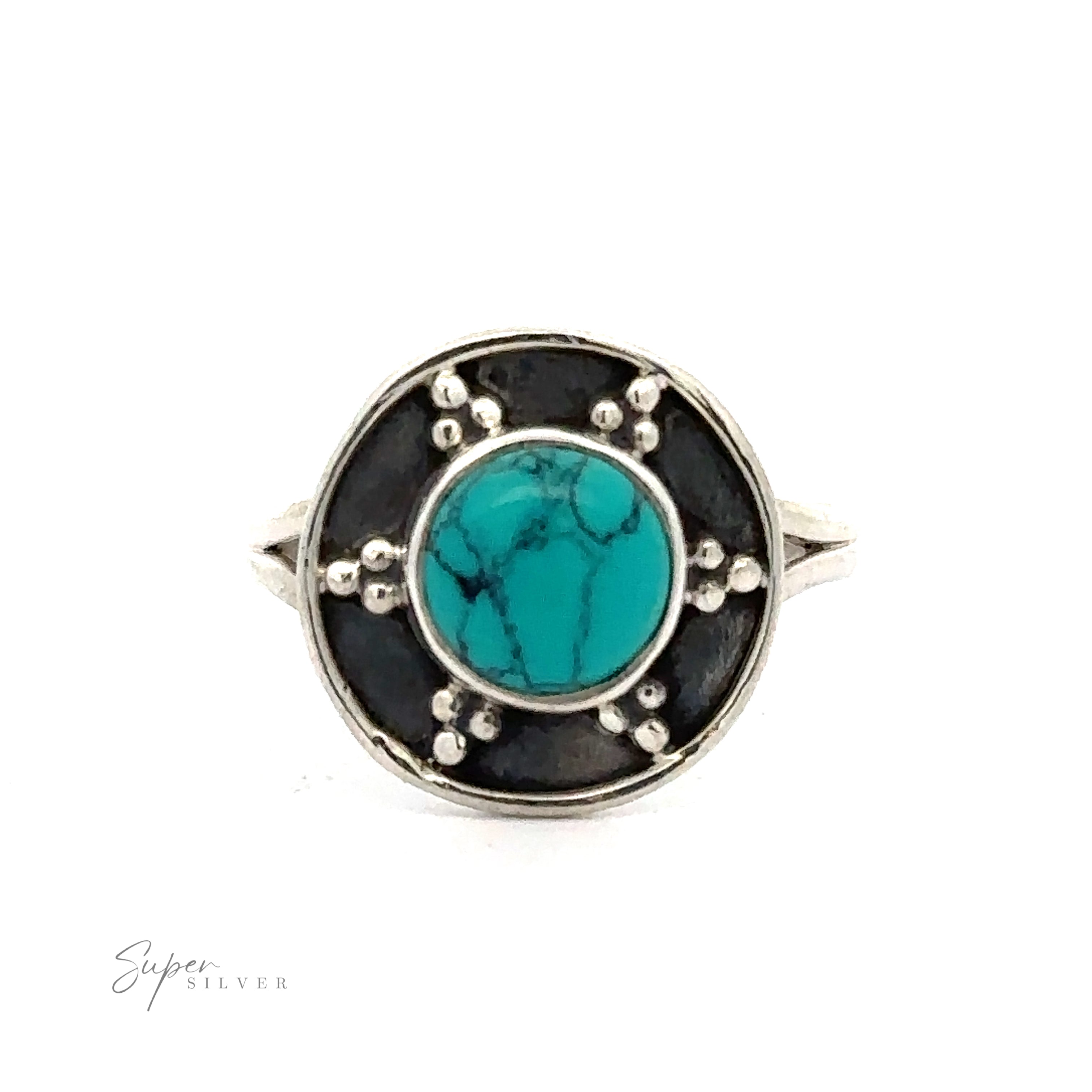 A Gemstone Ring With Unique Oxidized Design with a round turquoise stone in the center, surrounded by an oxidized silver design and silver dot accents. The ring is photographed against a white background.