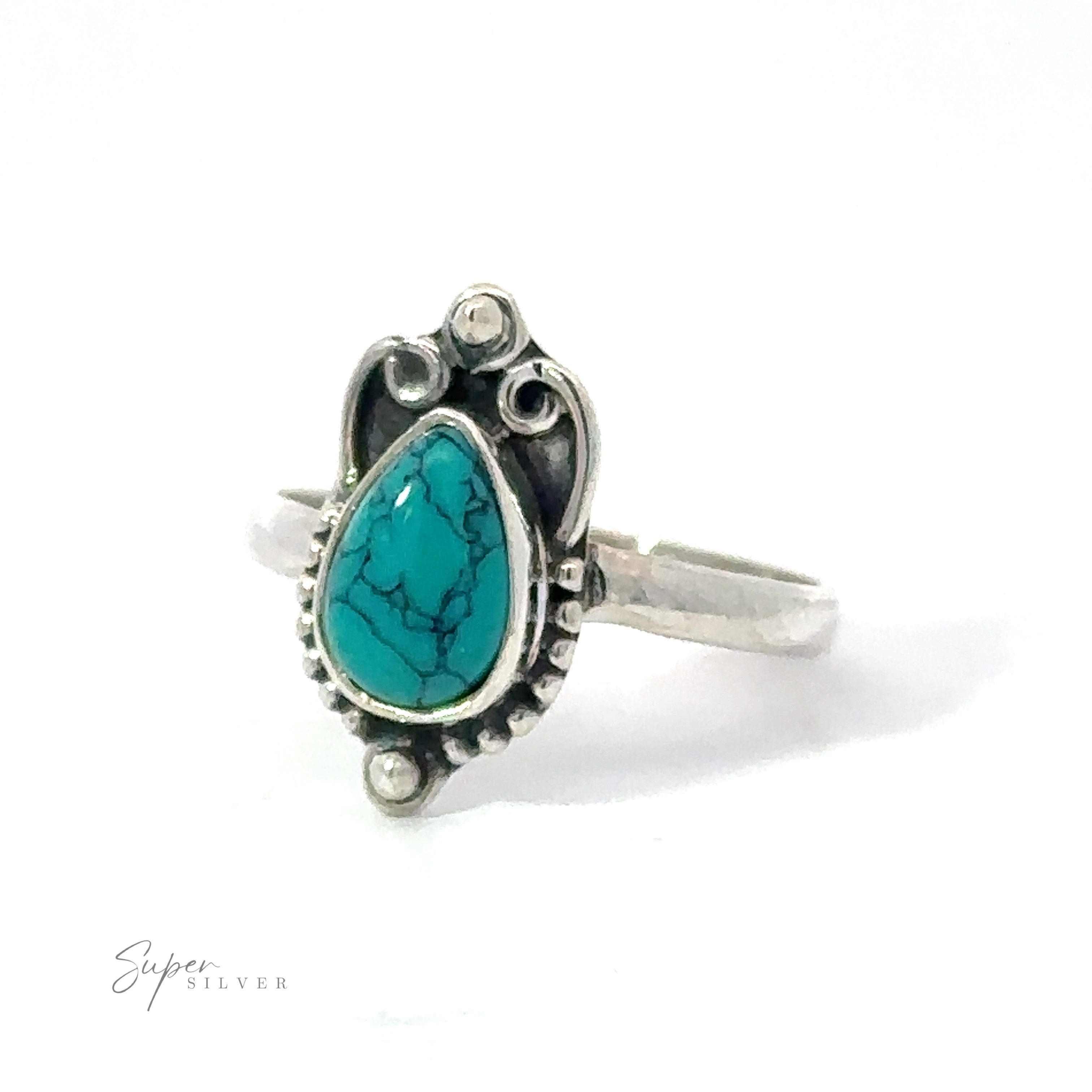 Sentence with Product Name included: A silver Vintage Inspired Teardrop Gemstone Ring featuring a teal turquoise teardrop gemstone set in an ornate bezel, isolated on a white background.
