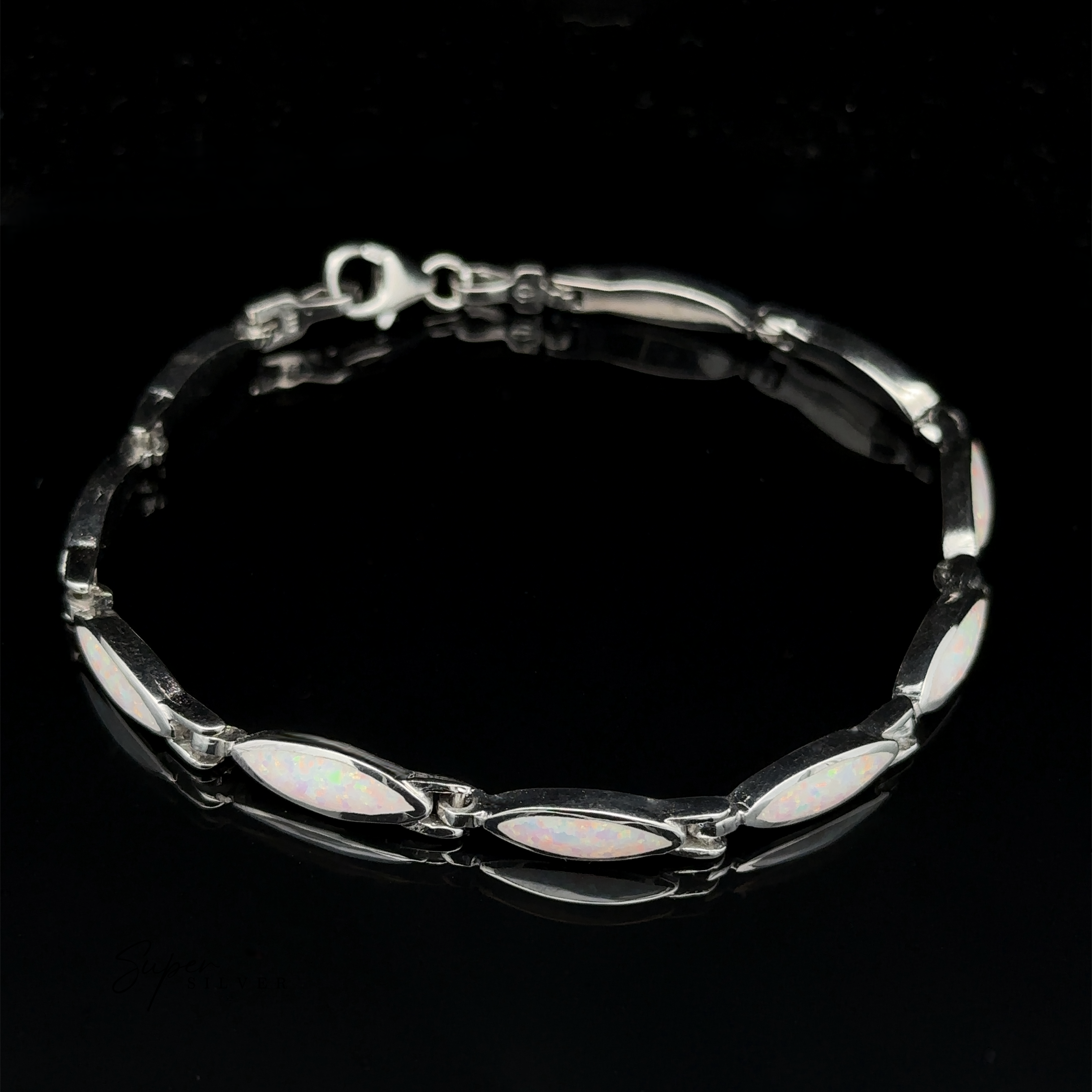 The Marquise Shaped Lab-Created Opal Bracelet features a modern design with marquise-shaped lab-created opal stones set in the links, arranged in a chain pattern against a black background.