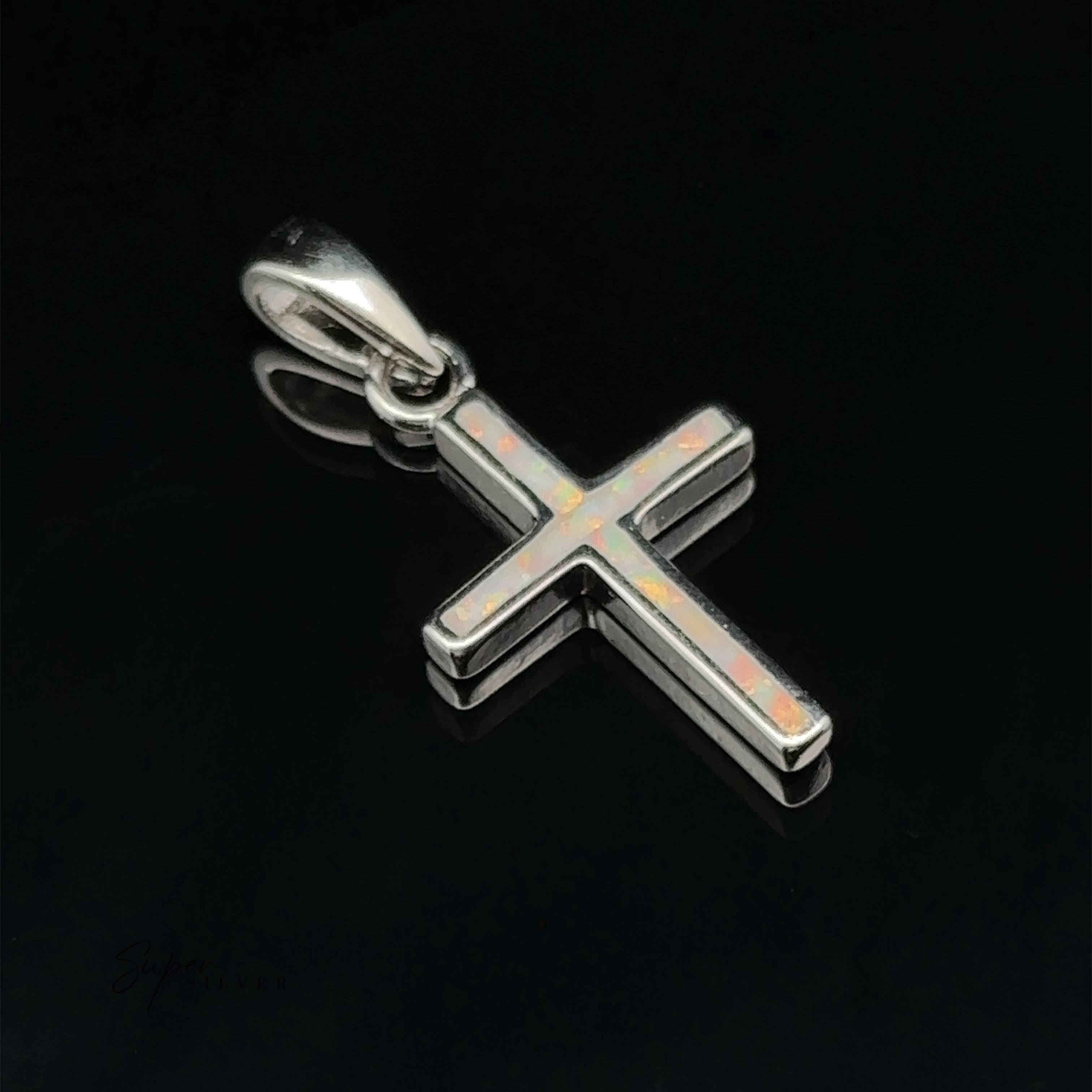 Lab-Created Opal Cross Pendants set in sterling silver, elegantly displayed on a black background with minimalist design.