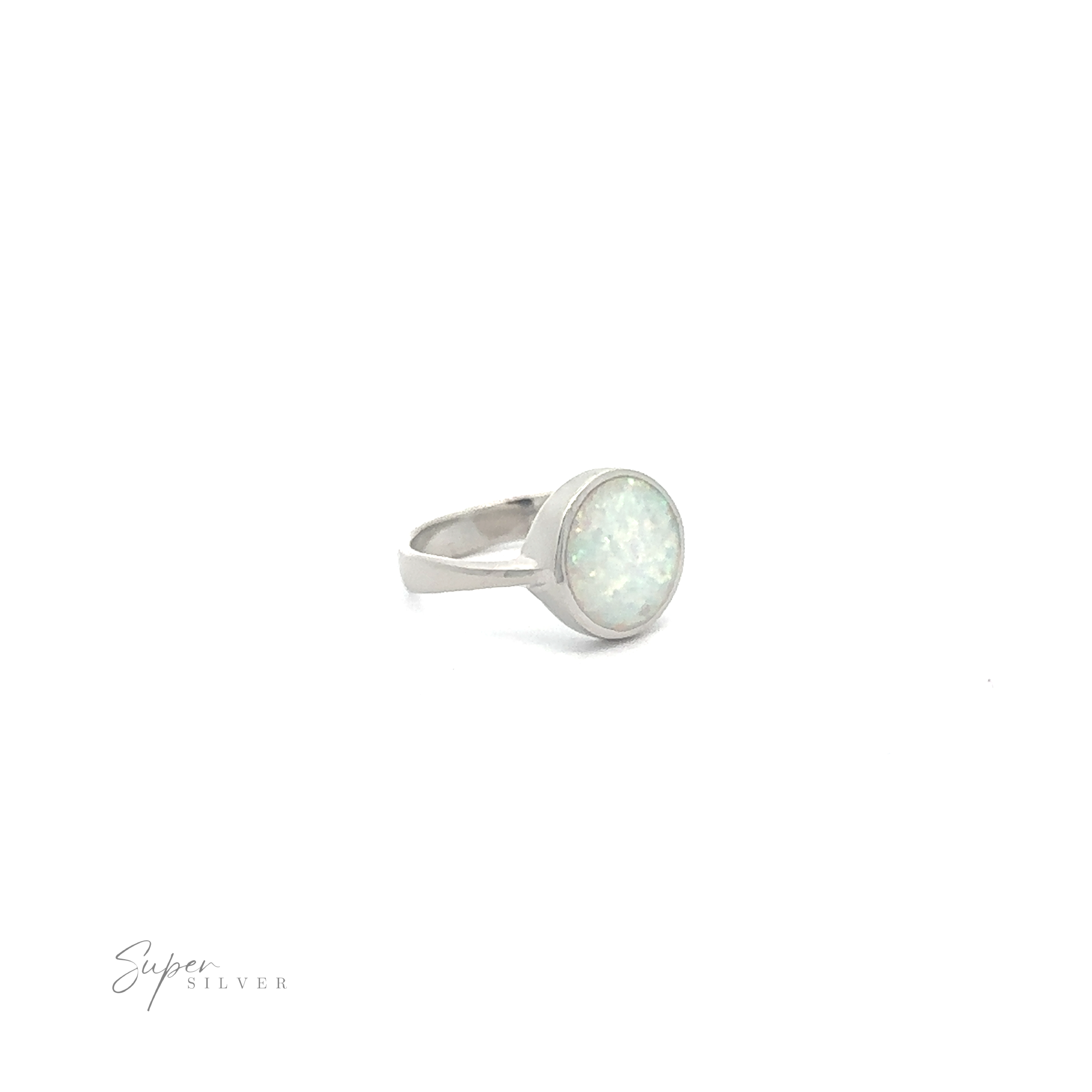 Simple Round White Opal Ring with a sterling silver band on a white background.