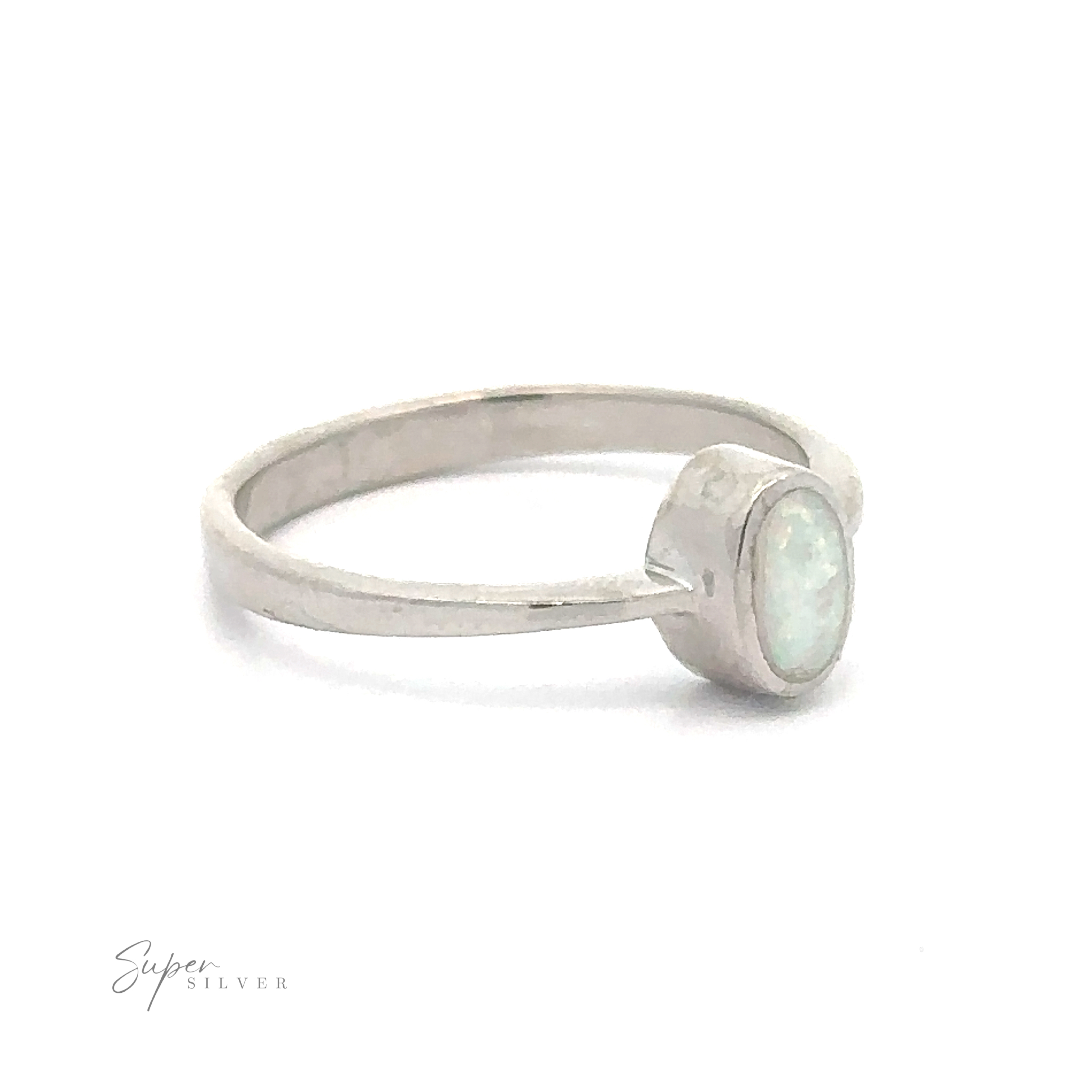 A rhodium plated silver ring with a Rectangular Lab Opal stone set in a bezel setting.