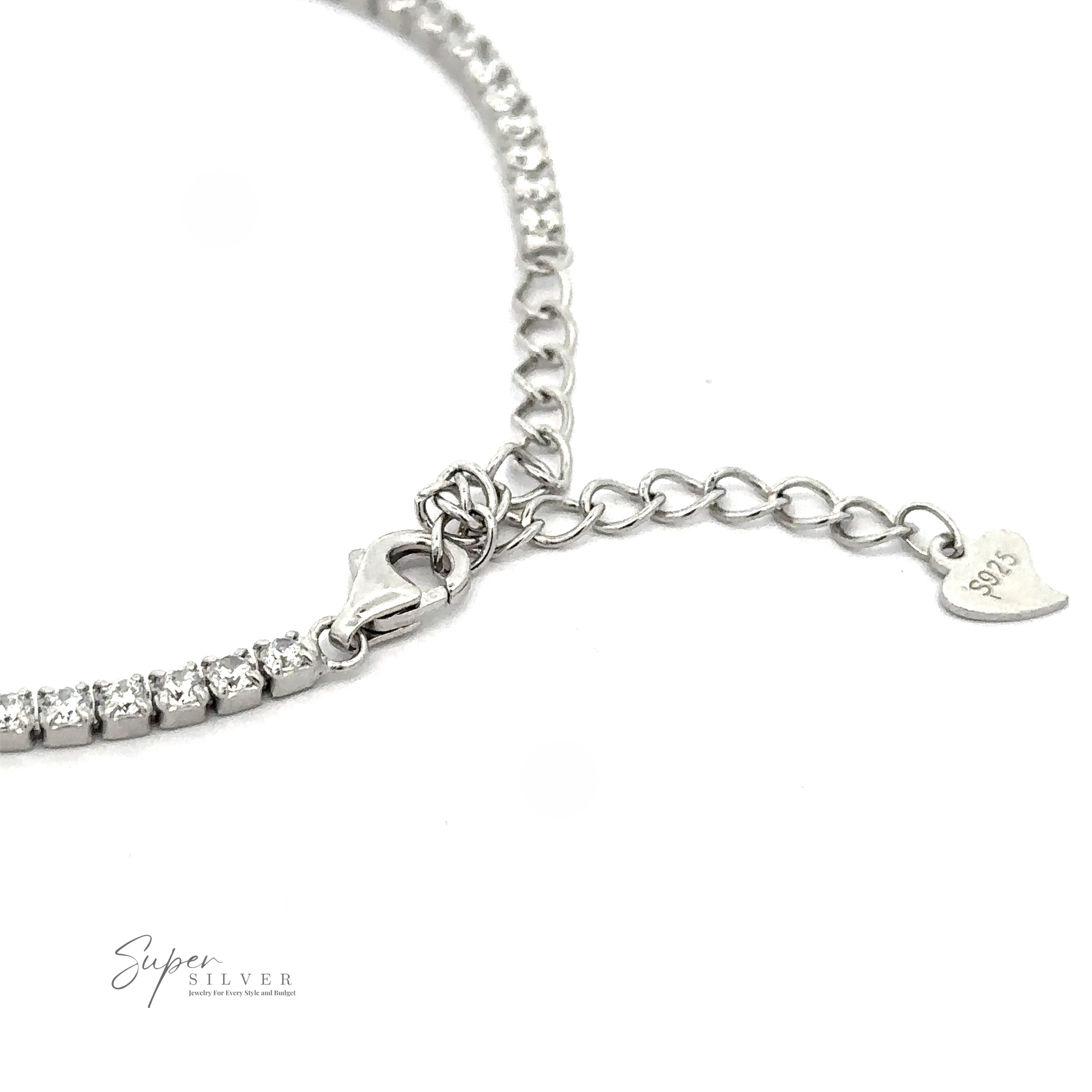 Close-up image of a Square Cubic Zirconia Tennis Bracelet with a chain extension, heart-shaped charm marked "925," and a row of clear cubic zirconia stones. Logo "Super Silver" visible in the bottom left corner.