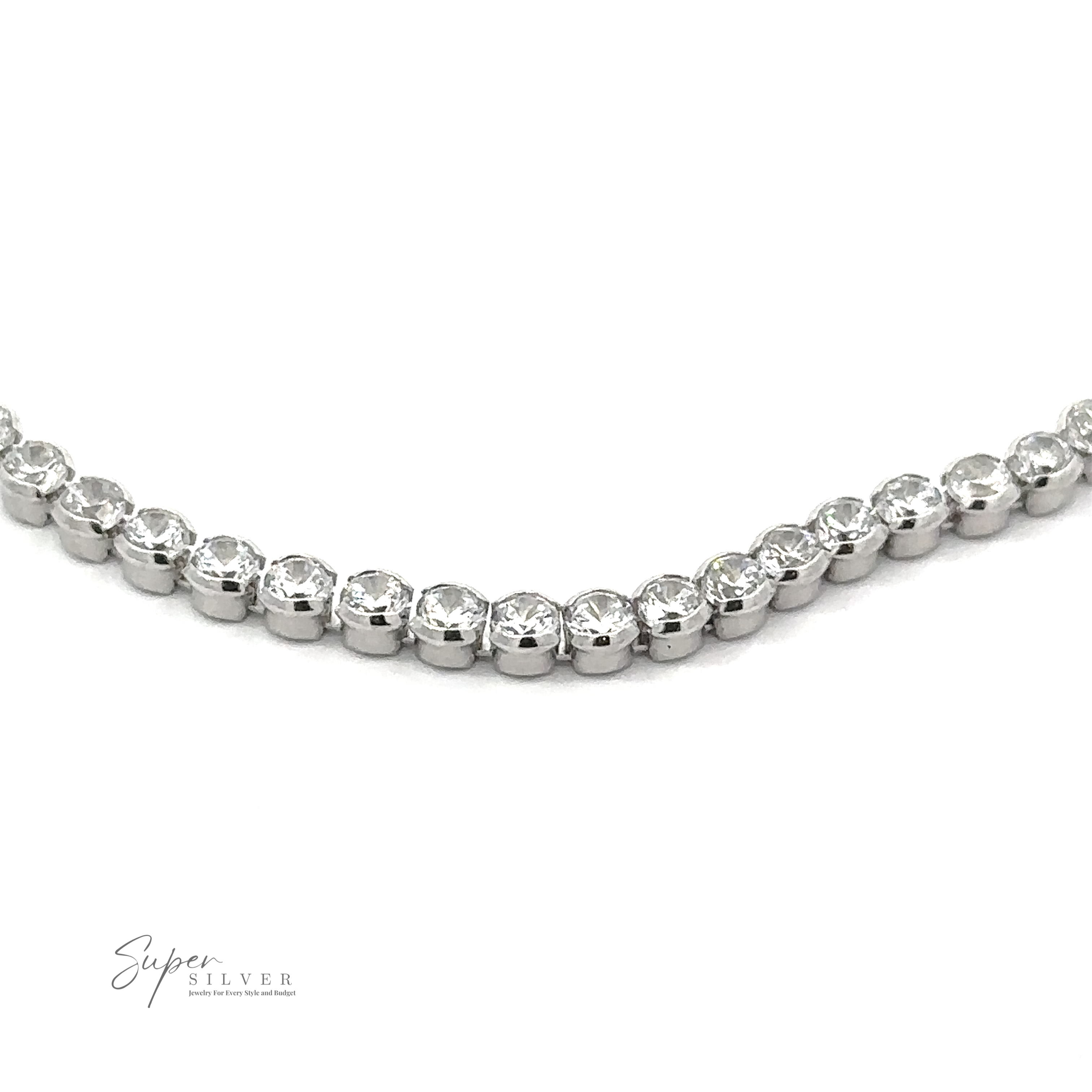 A close-up of a stunning Round Cubic Zirconia Tennis Bracelet showcases a row of round, clear gemstones set in .925 Sterling Silver. The bracelet is labeled "Super Silver" in the lower left corner, highlighting its exquisite craftsmanship.