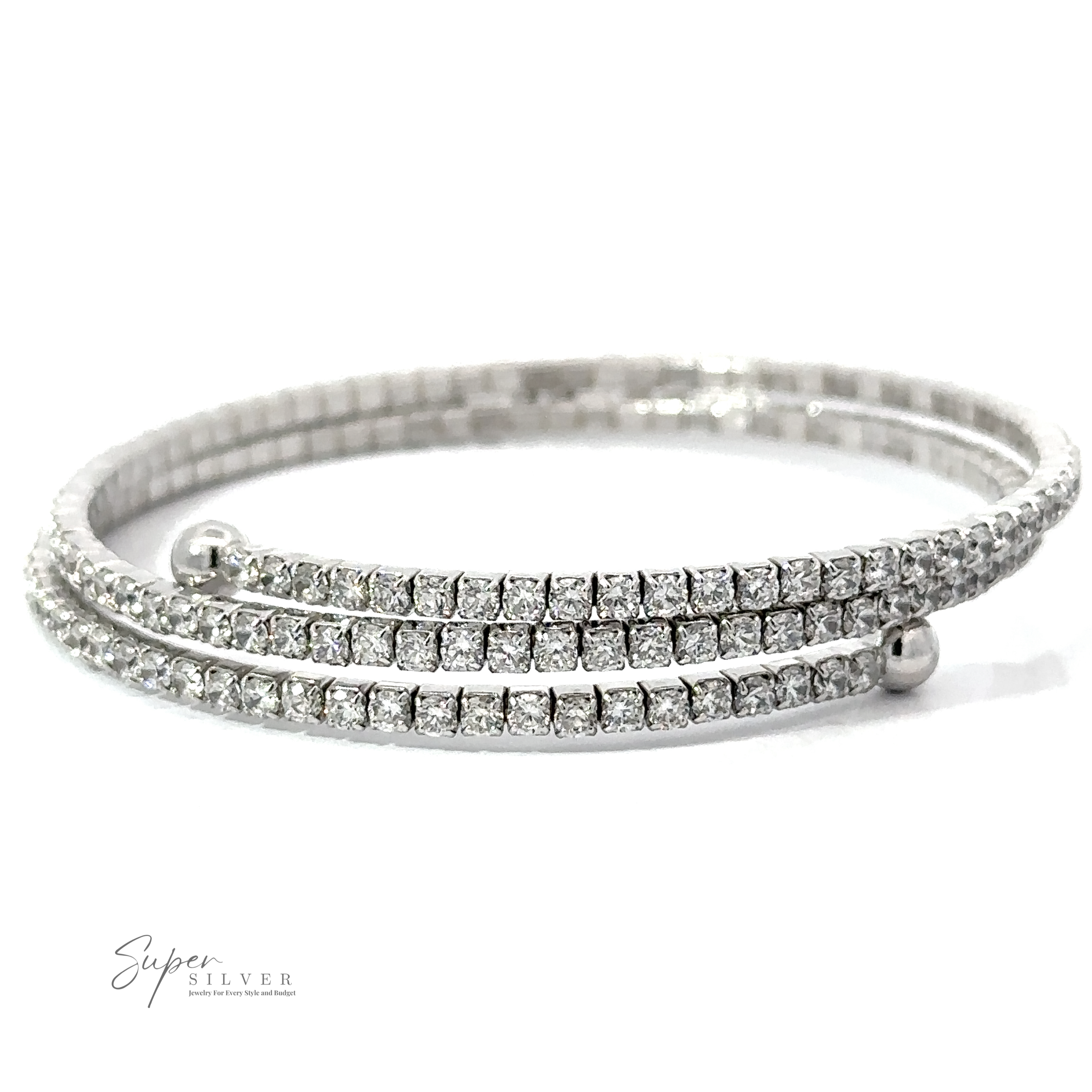 A sparkling silver bracelet with multiple rows of small square-cut Cubic Zirconia. The logo "Super Silver" is visible in the lower-left corner, and it's crafted from Rhodium Plated .925 Sterling Silver for lasting brilliance. The Cubic Zirconia Simple Wrap Bracelet adds a touch of elegance to any outfit.