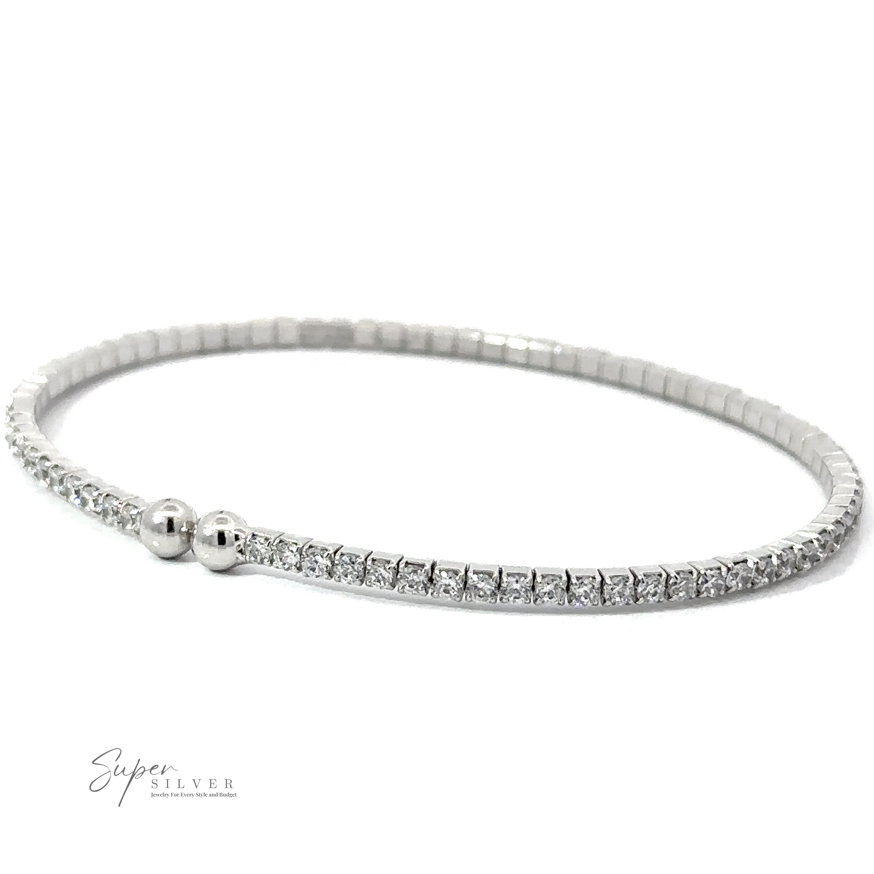 A Cubic Zirconia Simple Wrap Bracelet with small, round, white Cubic Zirconia stones and two silver beads near the clasp, displayed on a white background. The adjustable wrist design ensures a perfect fit. The logo "Super Silver" is in the bottom left corner.