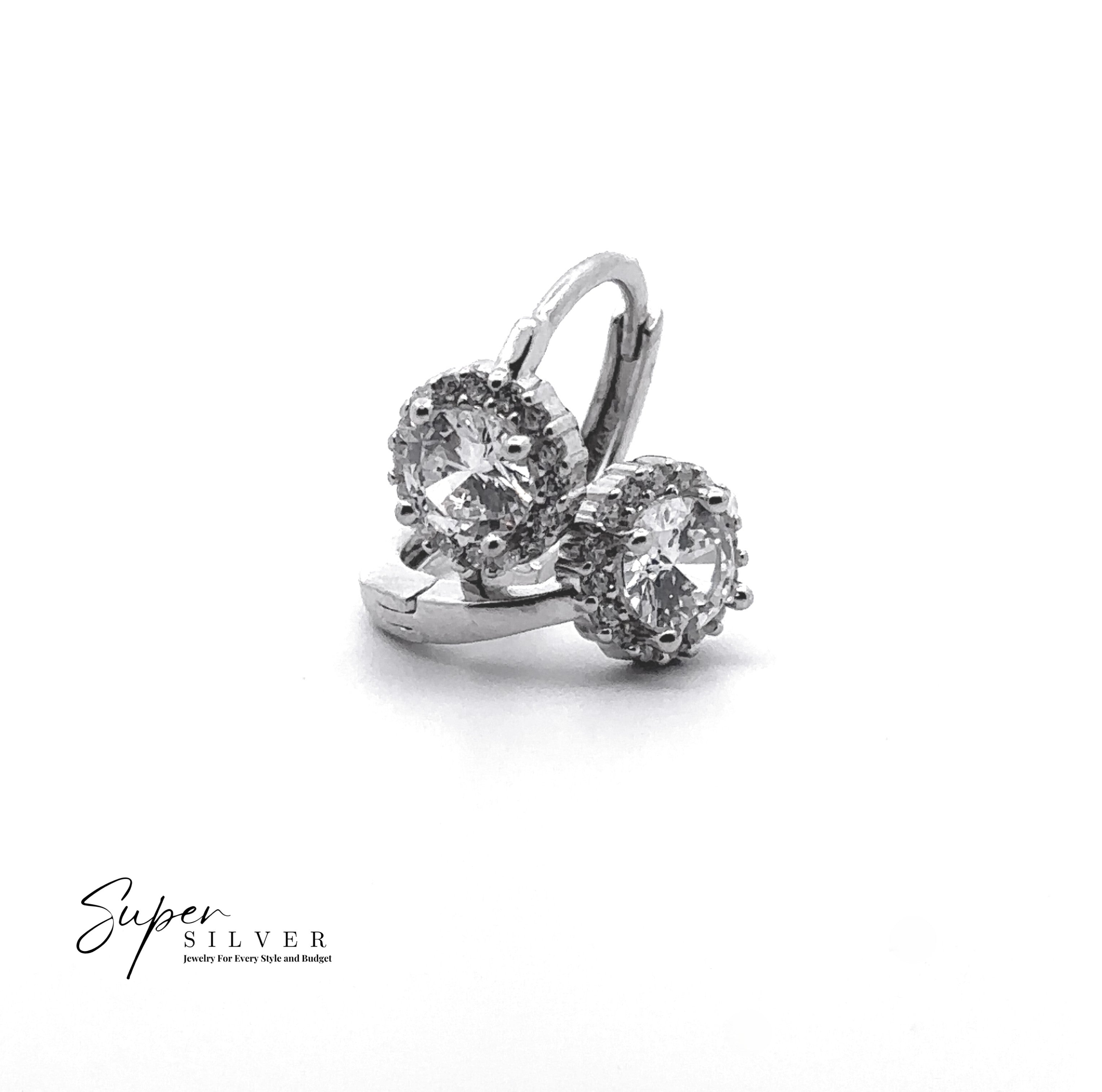 Close-up of The Halo Mini CZ Hoop: sterling silver earrings featuring round clear cubic zirconia stones in prong settings, displayed on a white background with the "Super Silver" logo in the bottom left corner.