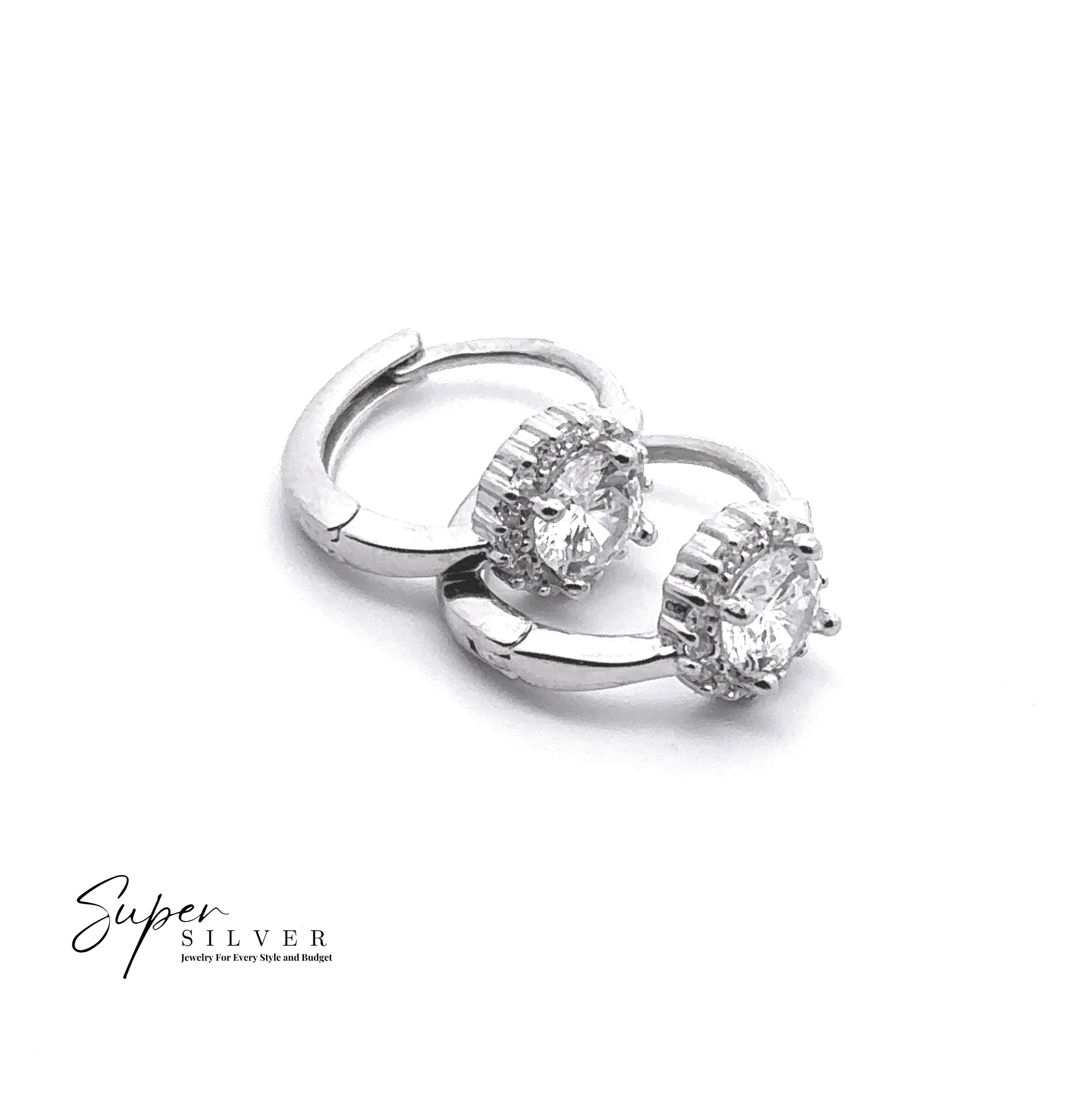 The Halo Mini CZ Hoop: Sterling silver huggie hoops set with round clear cubic zirconia in prong settings, shown on a white background featuring the "Super Silver" logo.