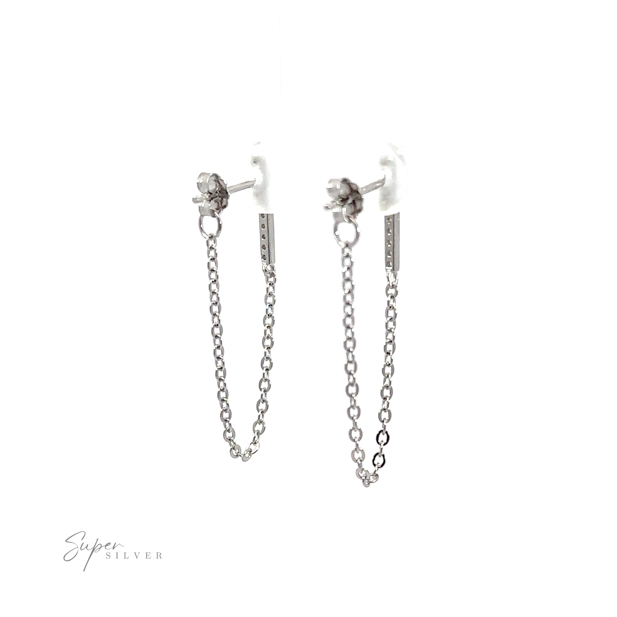 A pair of CZ bar studs with chain earrings with a minimalist design featuring cubic zirconia accents.