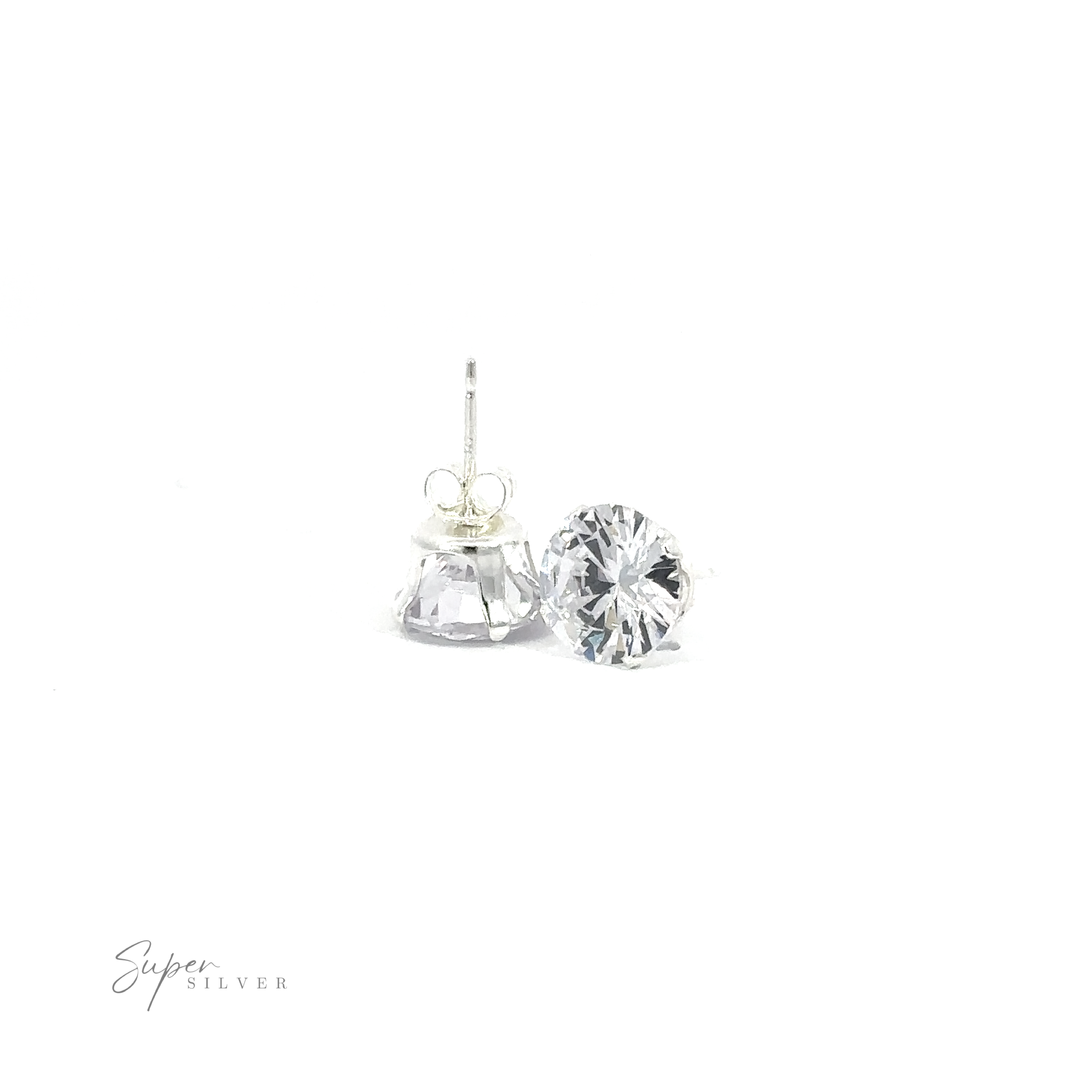 A pair of versatile Round CZ Studs, featuring cubic zirconia, with one earring standing upright and the other lying on its side.