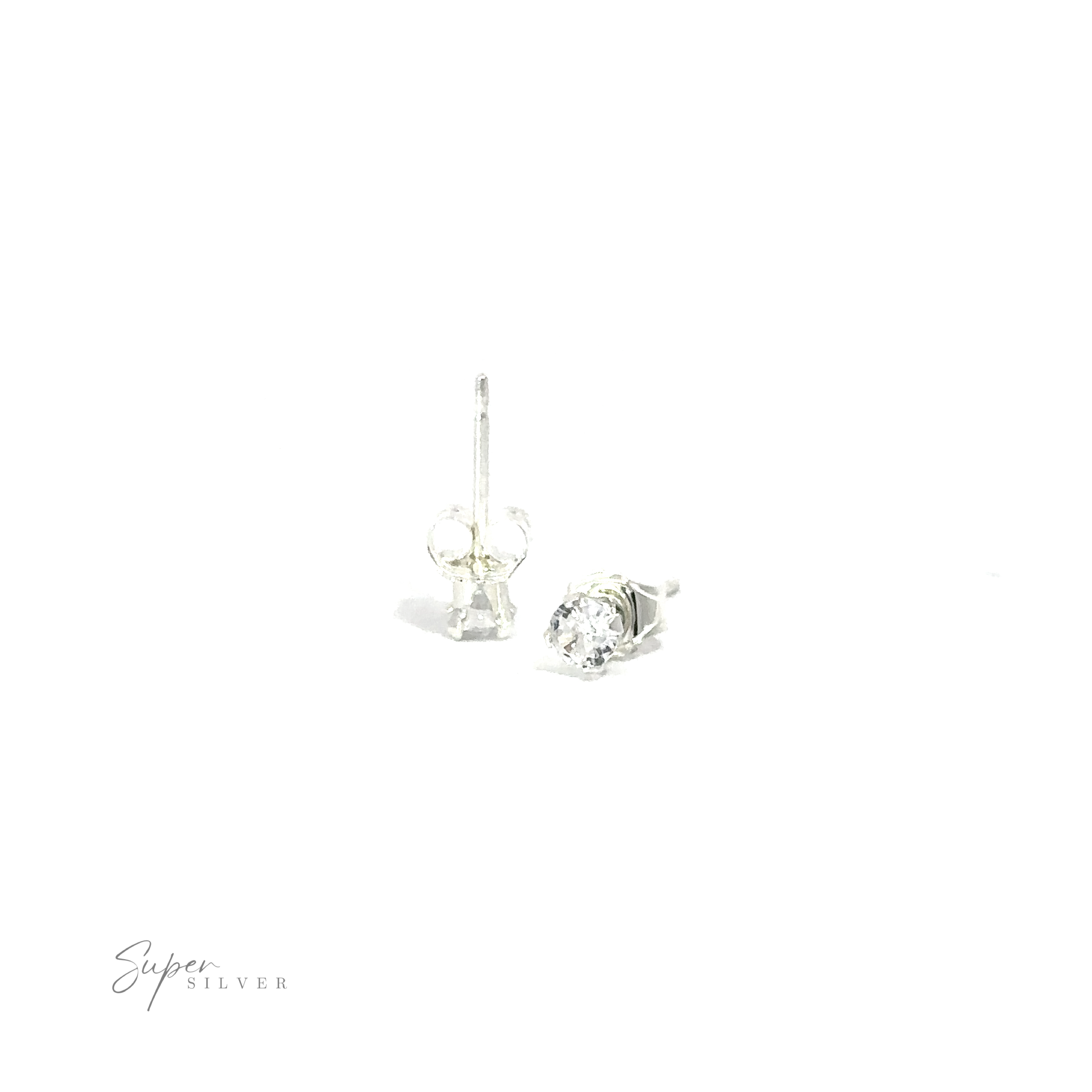 A pair of silver Round CZ Studs with a single cubic zirconia gemstone displayed on a white background.