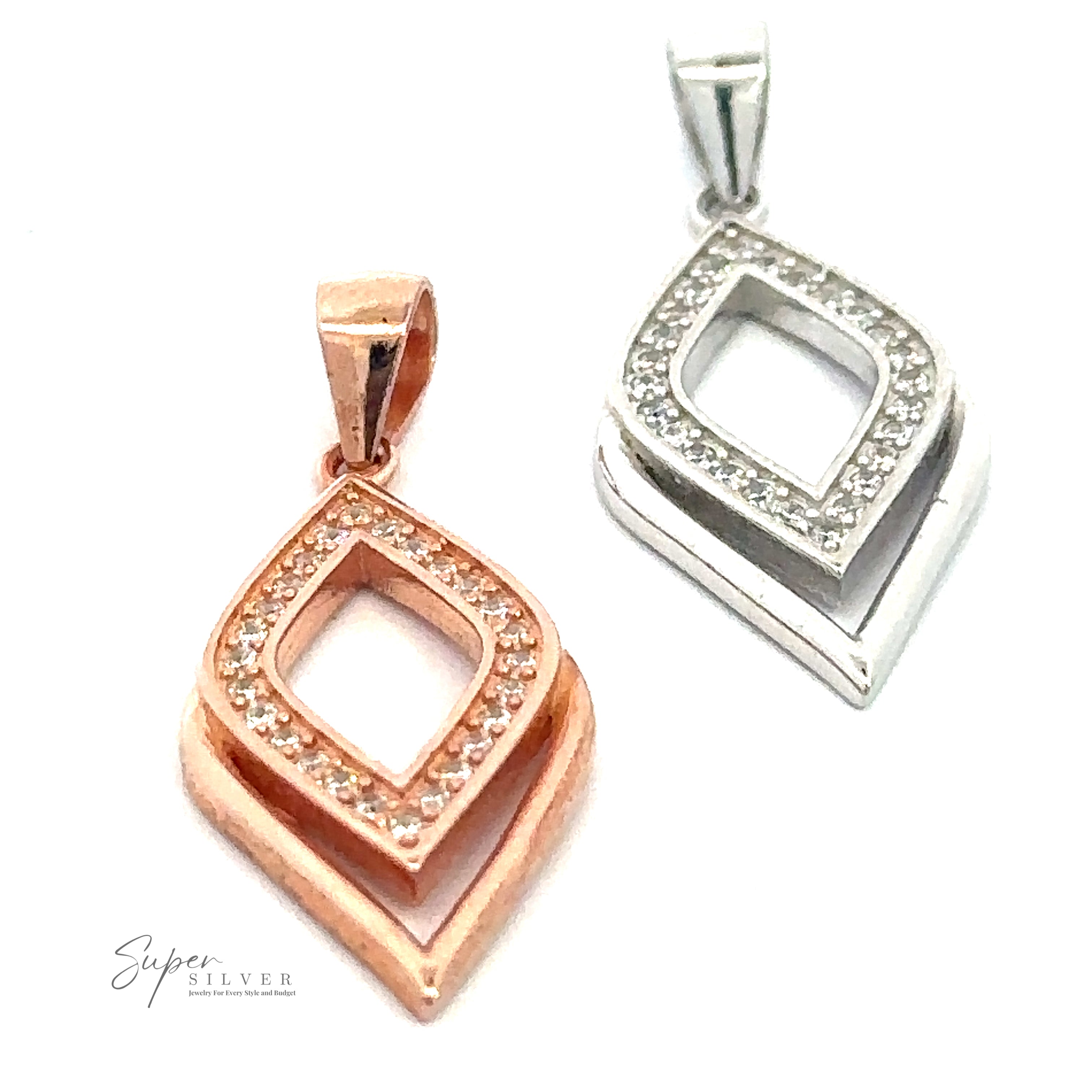 Two geometric, diamond-shaped pendants with inner diamond cutouts are shown. One is rose gold, and the other is sterling silver, both featuring small cubic zirconia crystals along the edges of the Cubic Zirconia Leaf Shape Pendant.