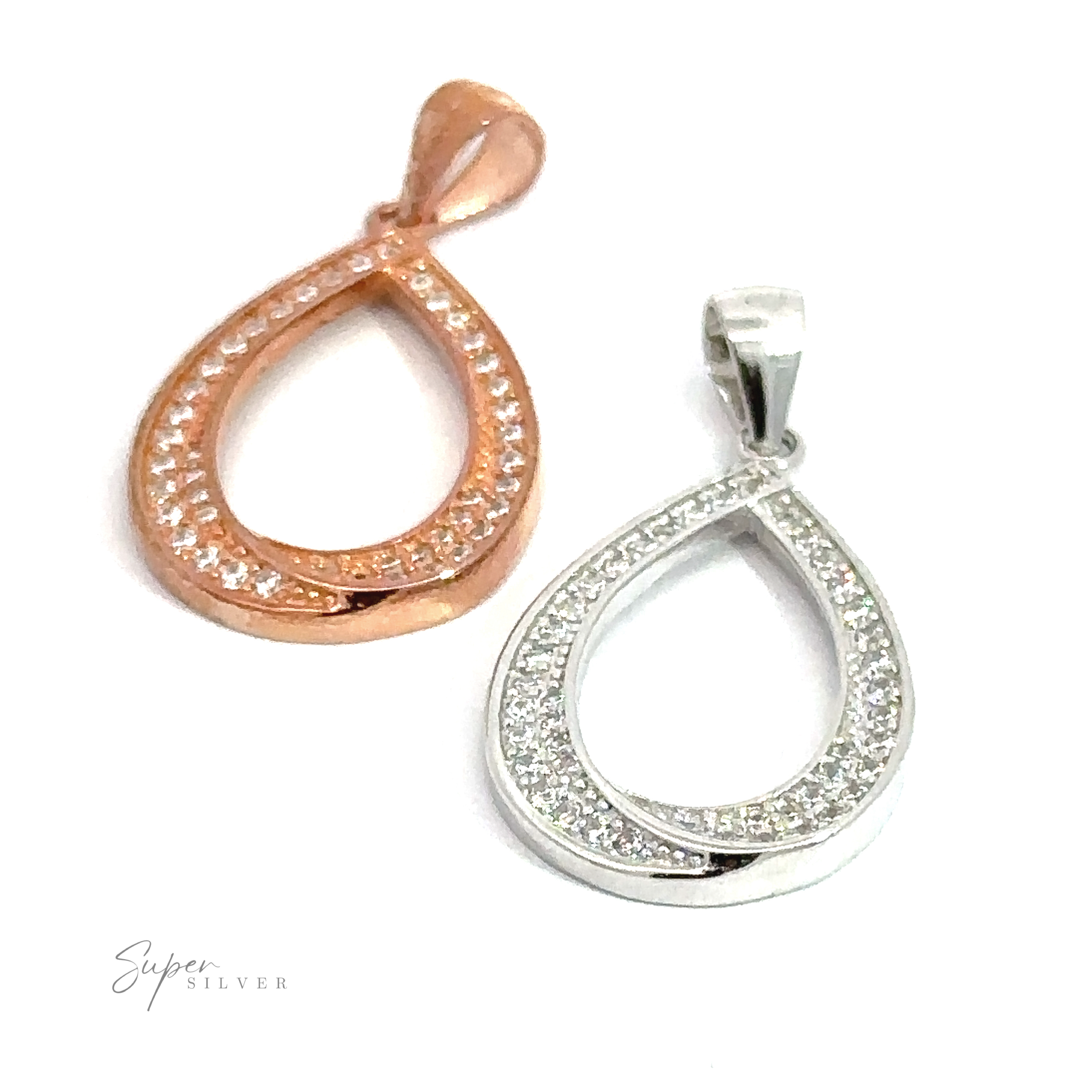 Two Teardrop Shape Cubic Zirconia Pendants, one in rose gold and the other in rhodium-plated sterling silver, both encrusted with small crystals, placed on a white background.