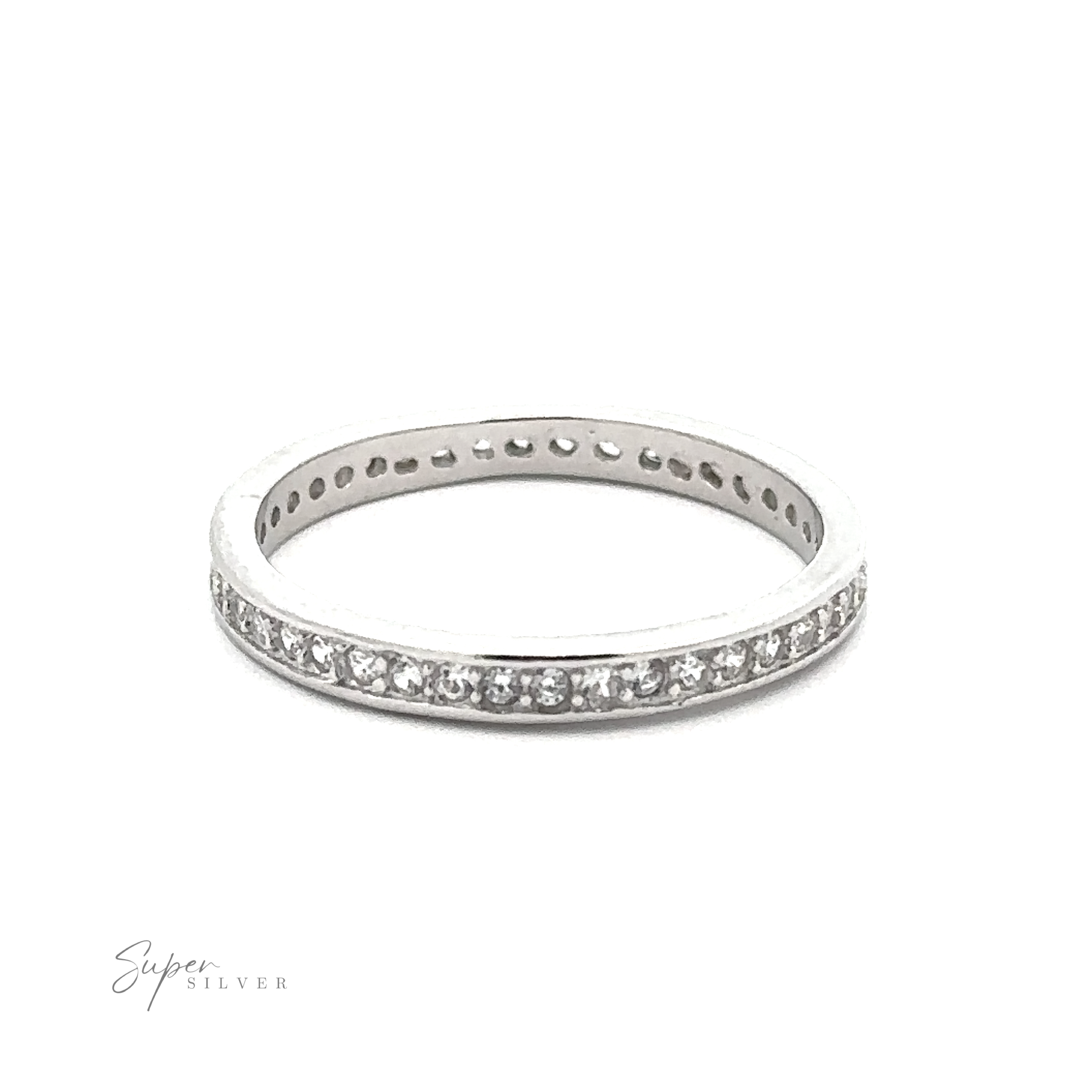 A *Classic Pave Cubic Zirconia Eternity Ring* crafted from .925 Sterling Silver, adorned with small, round cubic zirconia stones around its circumference, is positioned against a white background. The words "Super Silver" are written in the bottom left corner.