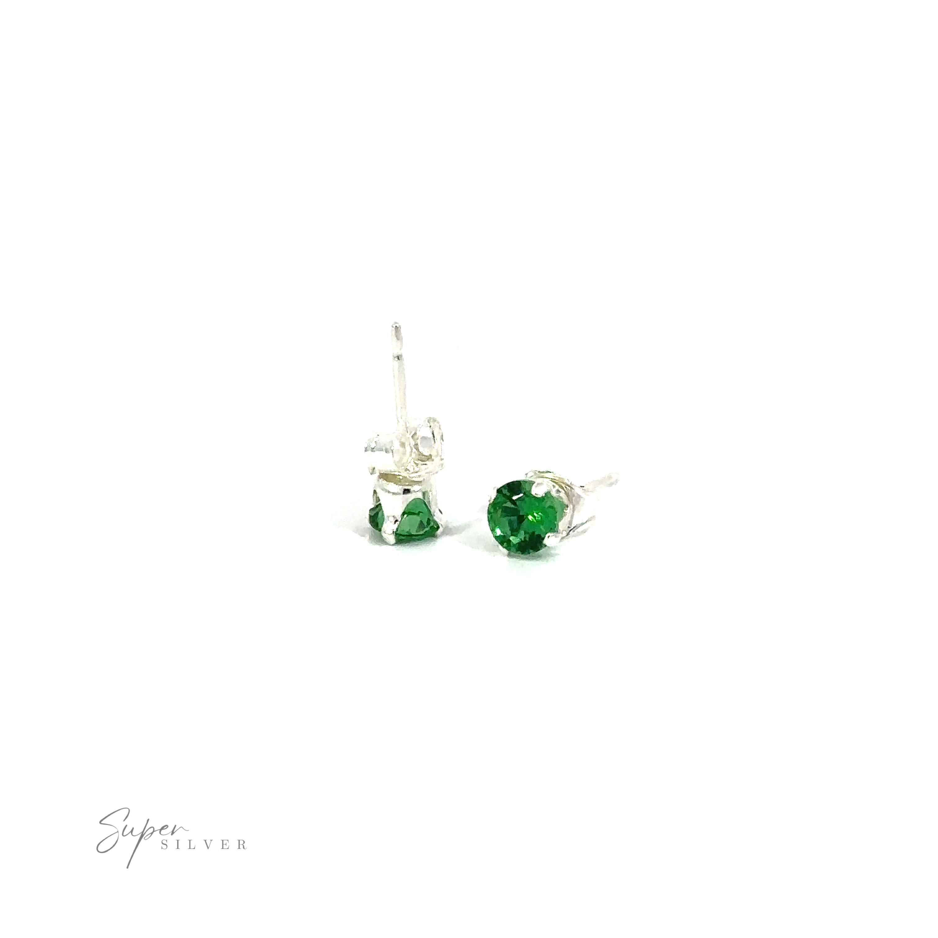 A pair of green Round CZ studs on a white background.