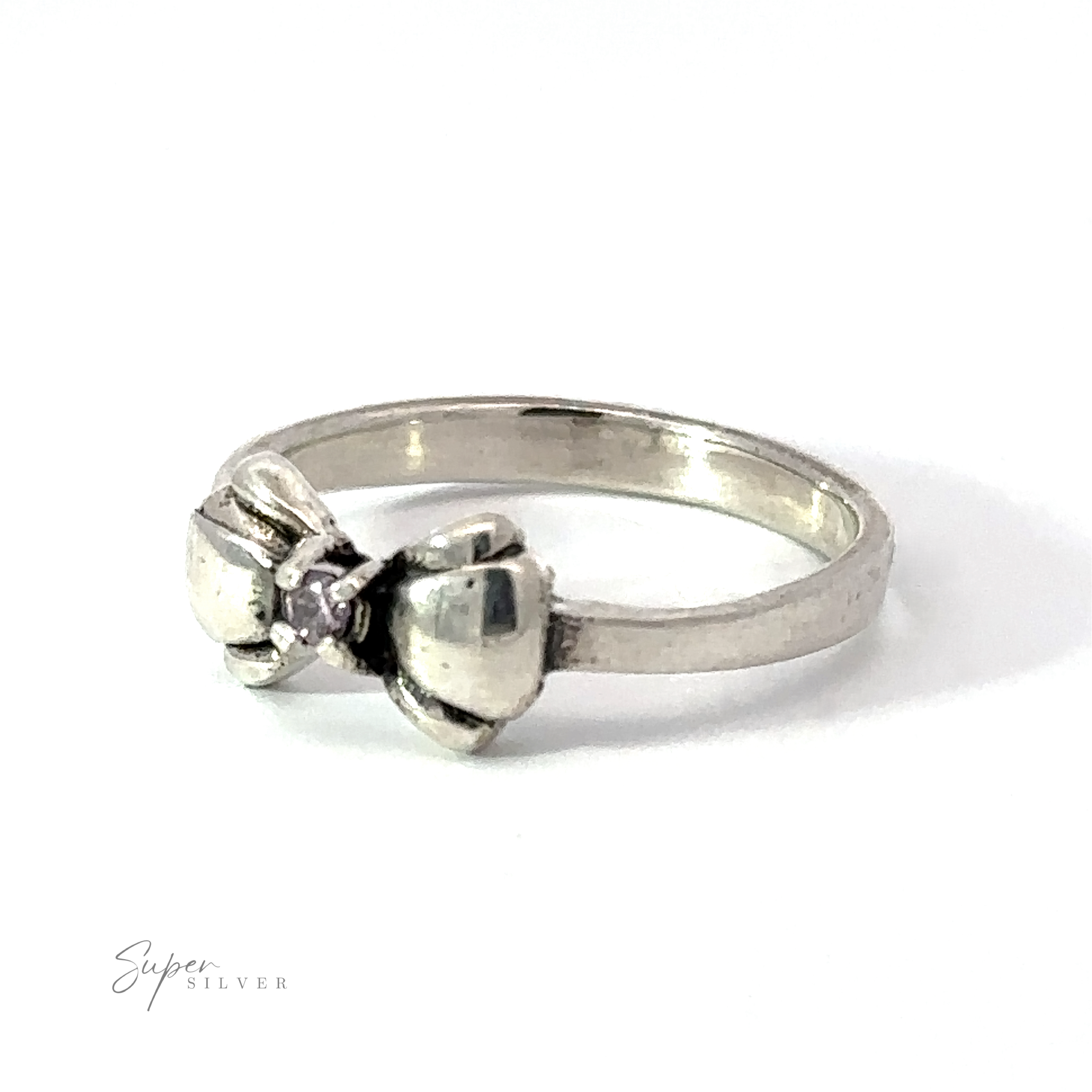 An Adorable Cubic Zirconia Bow Ring adorned with a black cubic zirconia at its center. The brand name, "Super Silver," is elegantly displayed in the bottom left corner of the image.