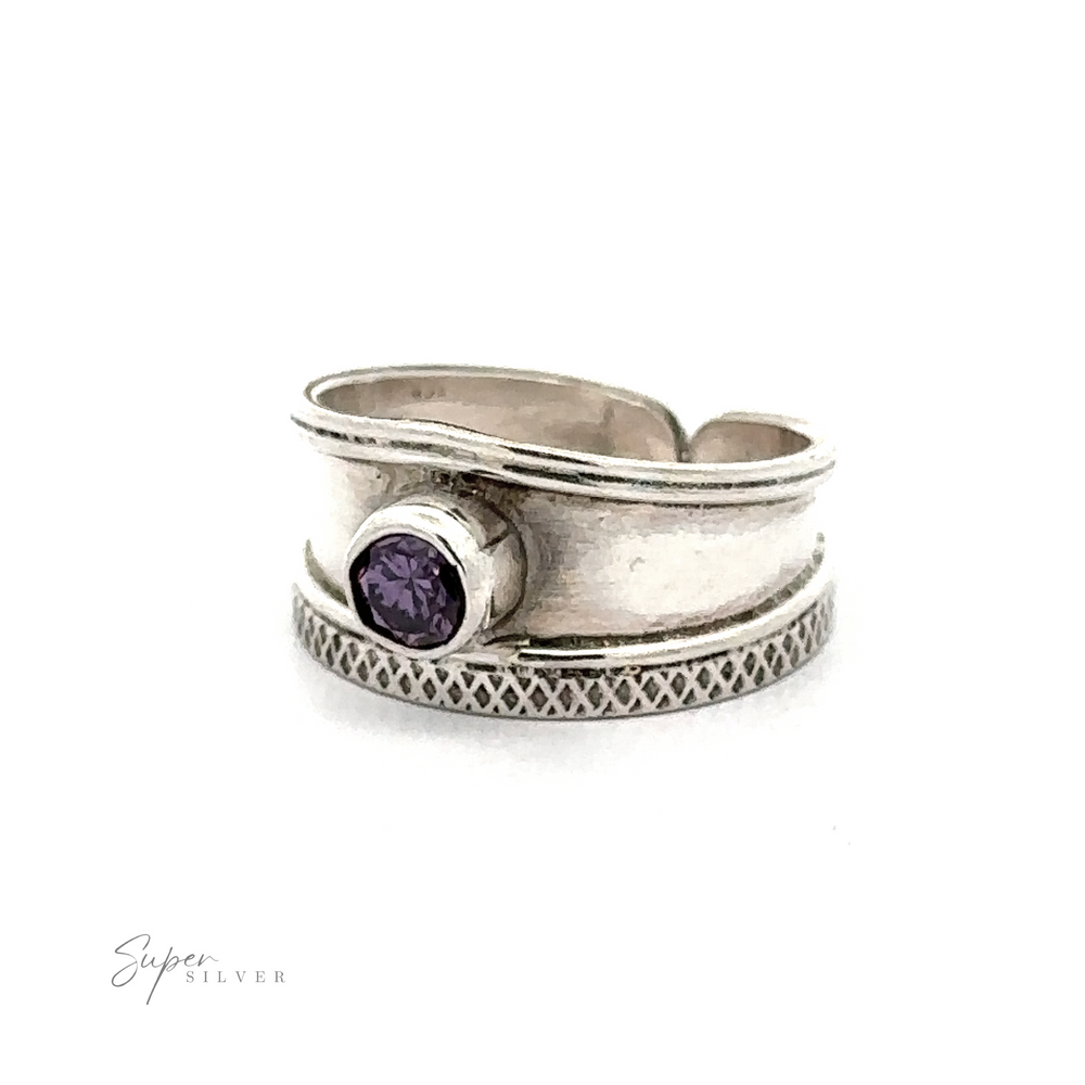 
                  
                    Sterling Silver Adjustable Wide Cigar Band Toe Ring with a small purple gemstone set in the center.
                  
                