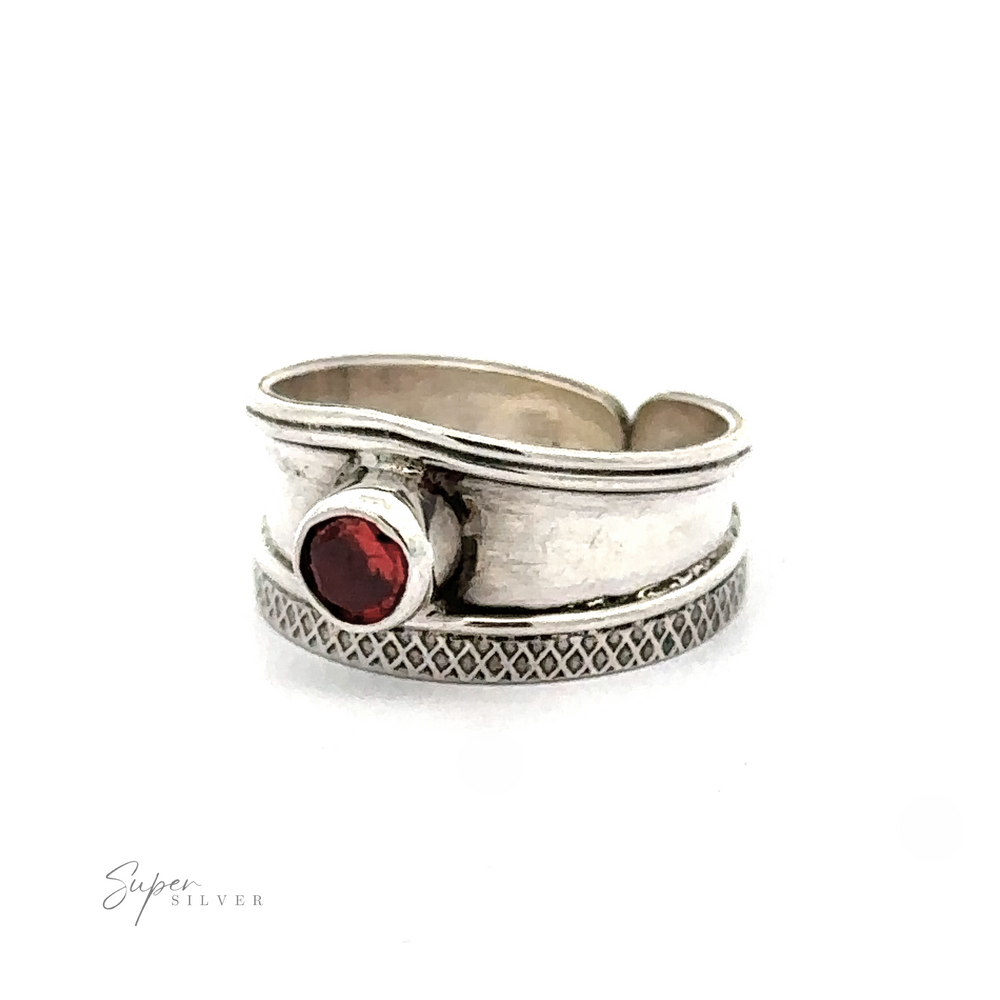 
                  
                    Adjustable Wide Cigar Band Toe Ring with Gemstone featuring a unique, layered band design with one red gemstone and textured details against a white background.
                  
                