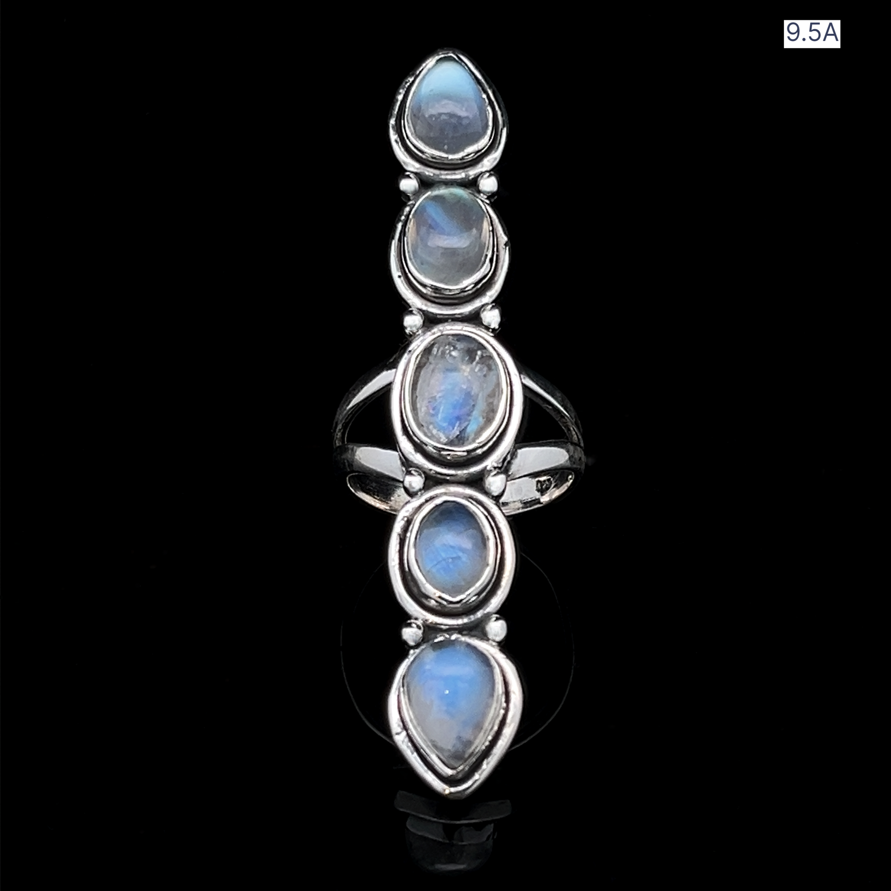 The Moonstone Ladder Ring features five vertically aligned oval blue moonstone cabochons set against black, with a "9.5A" size label in the top right corner, adding a unique touch to its bohemian sterling silver design.