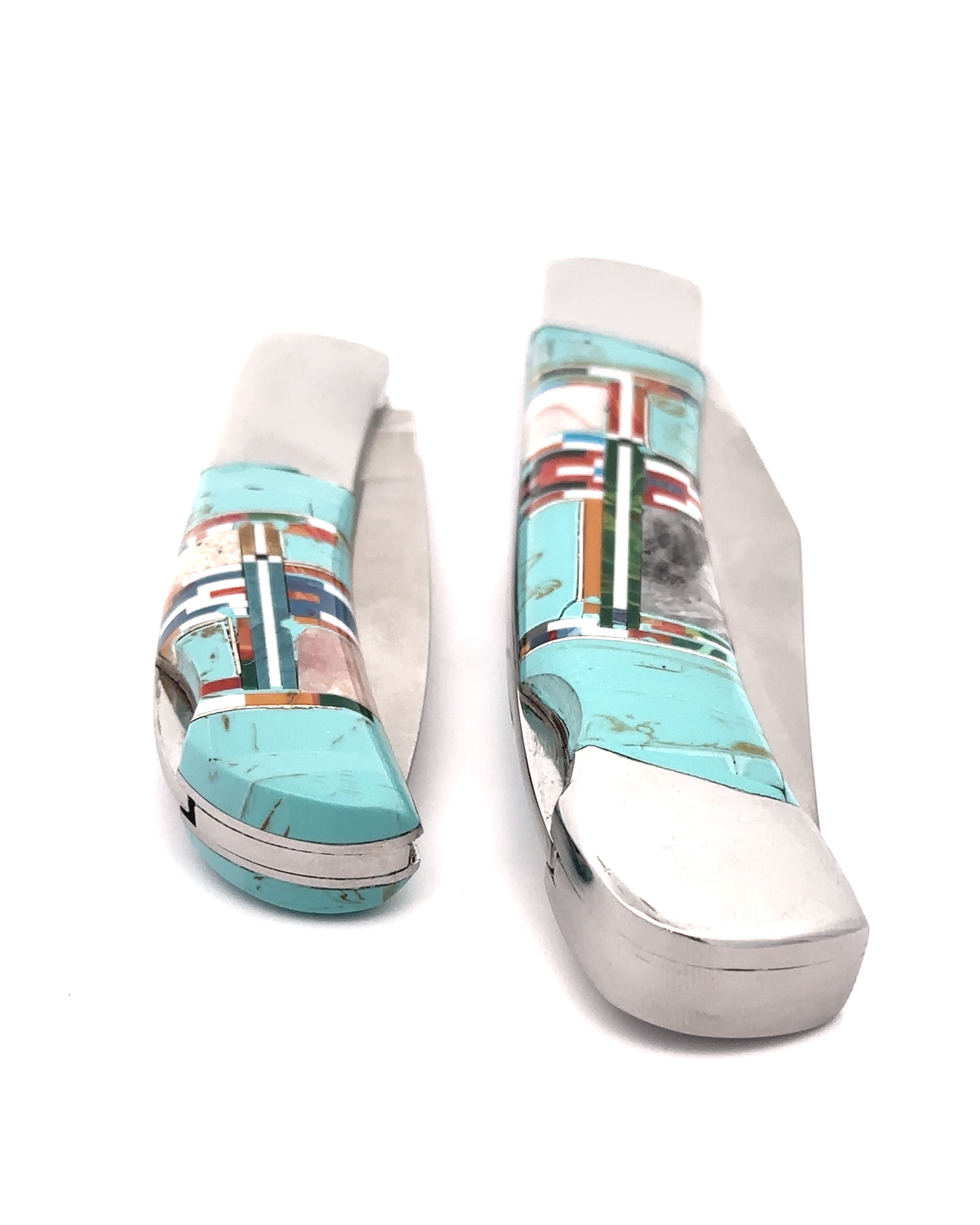 The Intricate Inlay Southwest Pocket Knives, with their turquoise and multicolored inlay handles encapsulating a distinct Southwest style, are displayed with both closed and open blades against a white background.