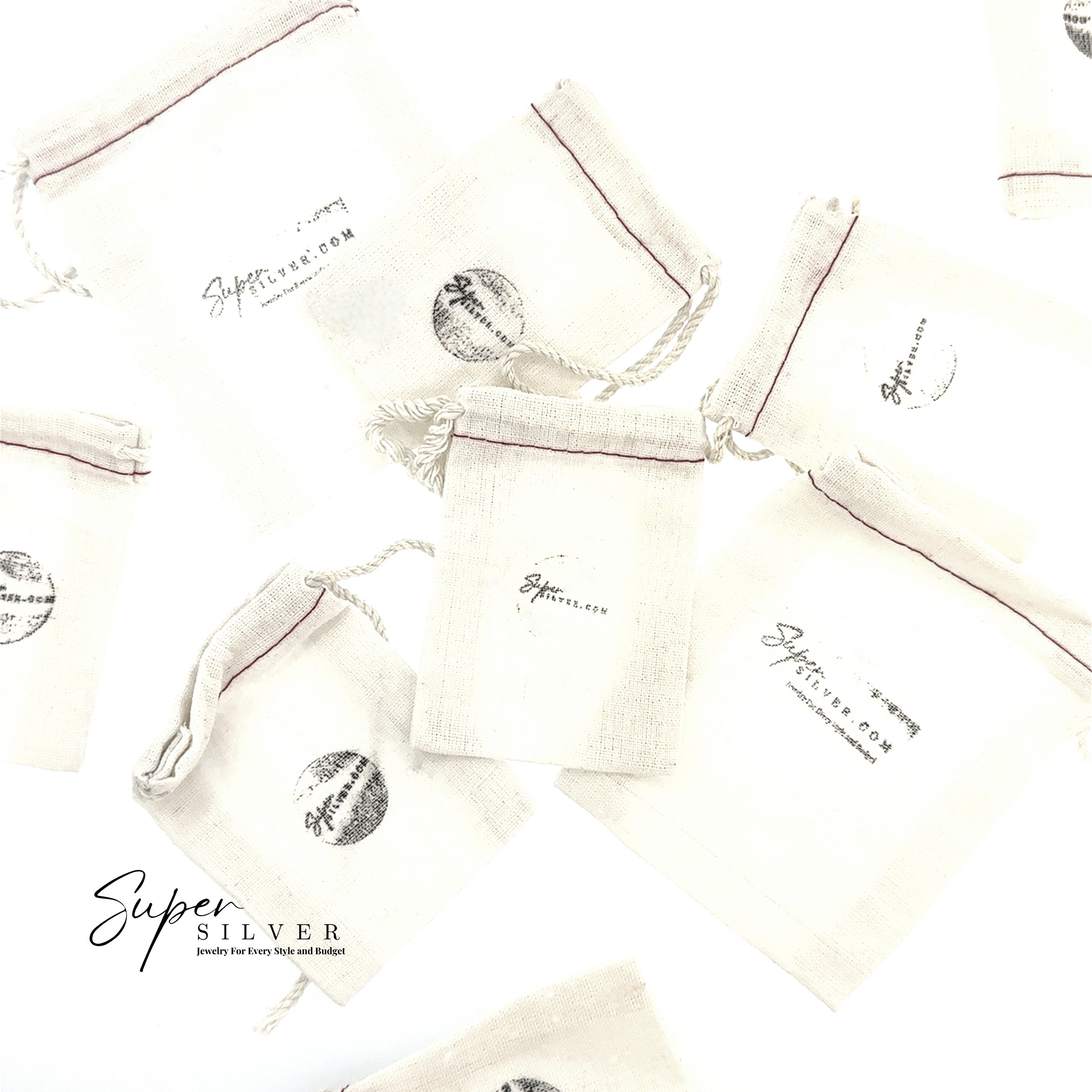 Several small "Gift Wrap" drawstring pouches made of light fabric are scattered on a white surface, adding a special touch to your order or gift wrap.