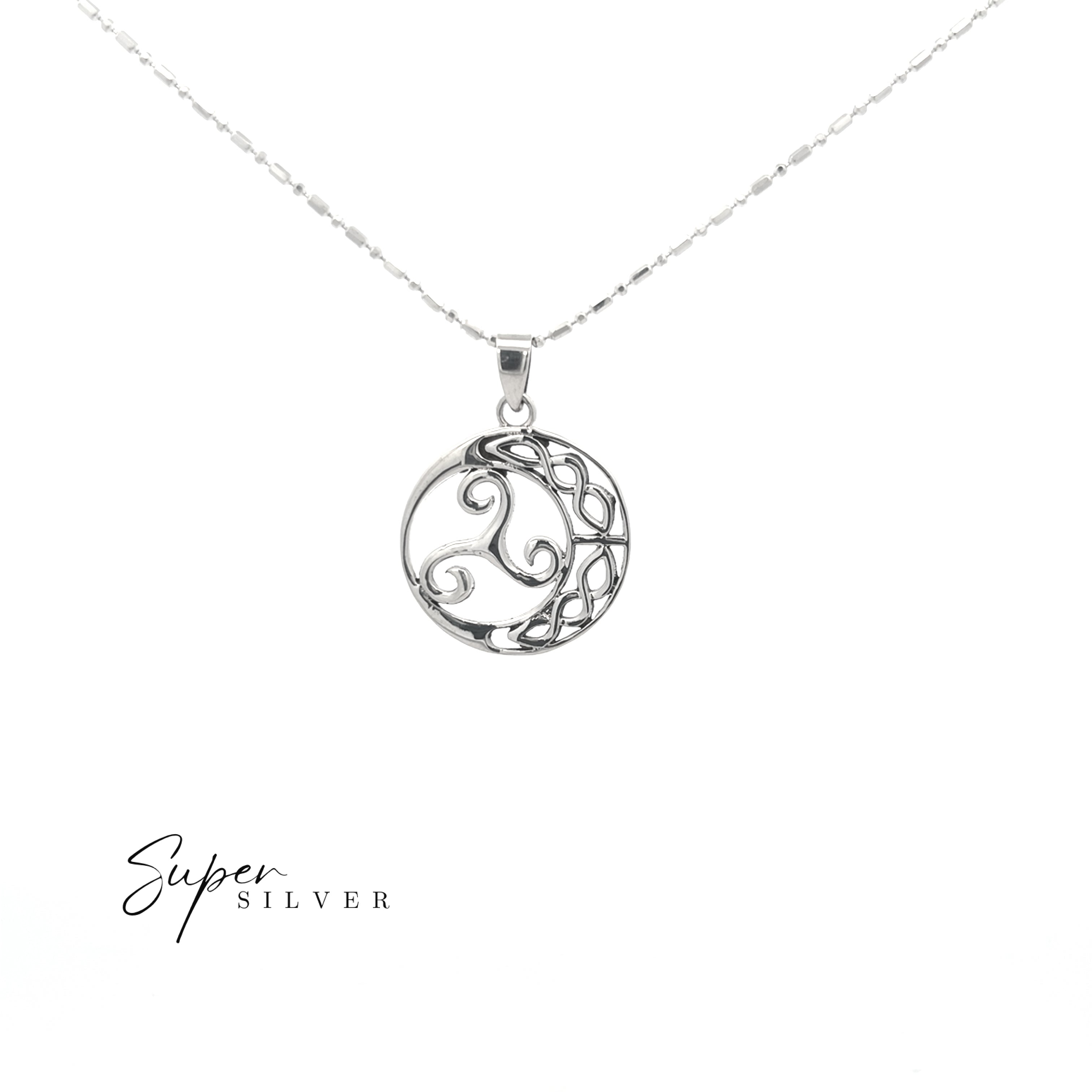 The Celtic Triskele Pendant, crafted in sterling silver with an ornate swirling circular design, hangs from a fine chain and is displayed against a white background with the "Super Silver" logo in the bottom left corner.