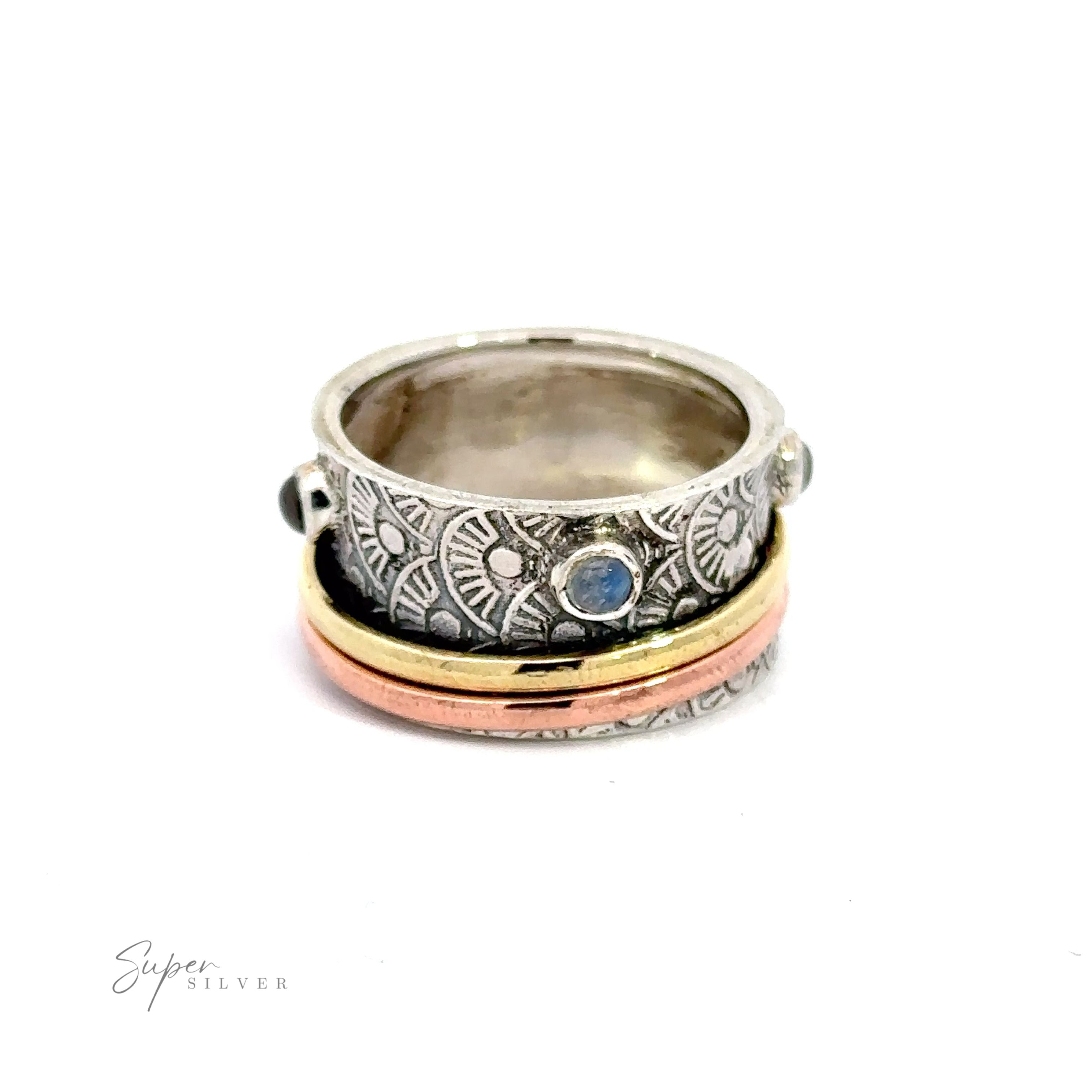 A Handmade Tricolor Spinner Ring with Moonstone Accents with a blue moonstone.