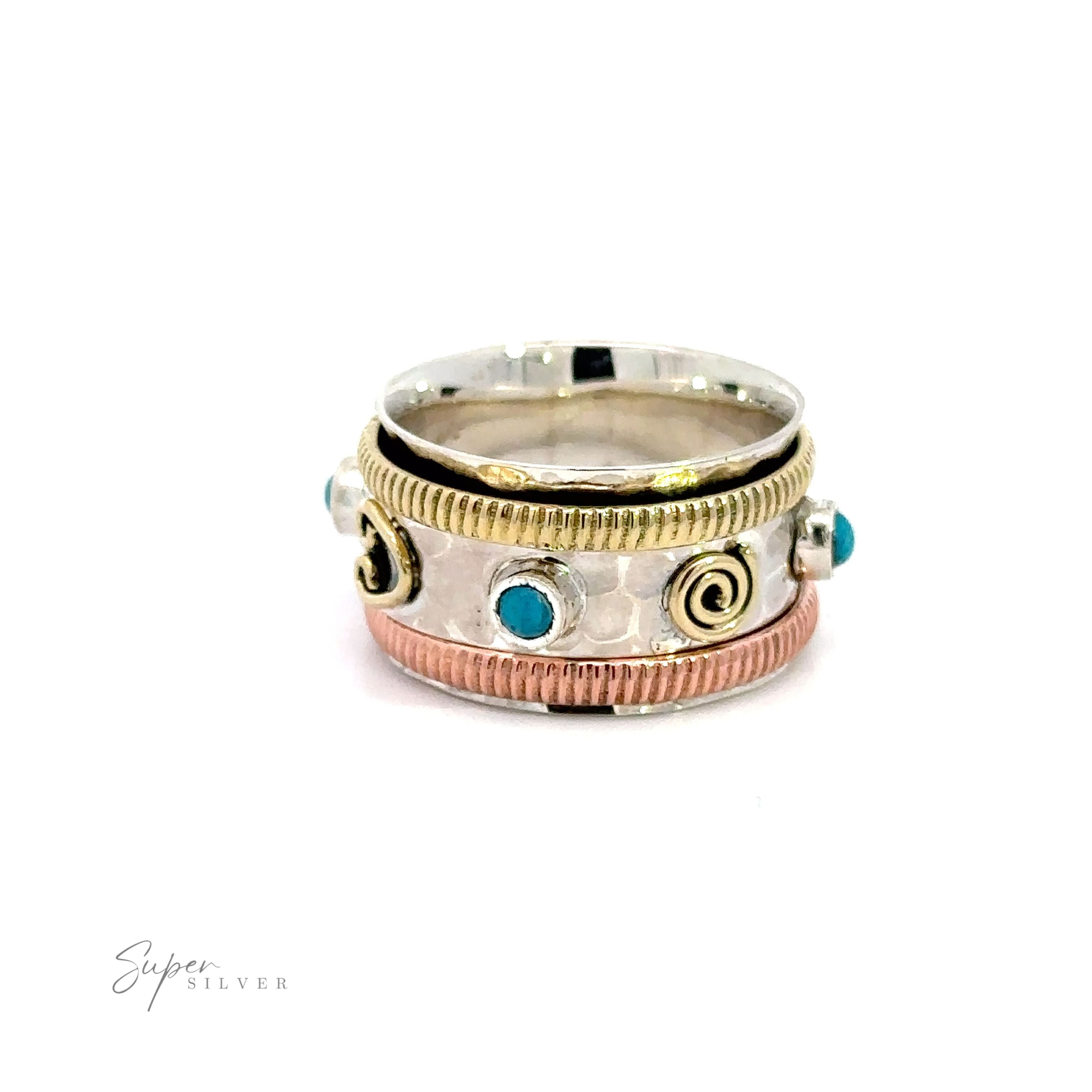 A Handmade Tricolor Turquoise Spinner Ring featuring turquoise stones.