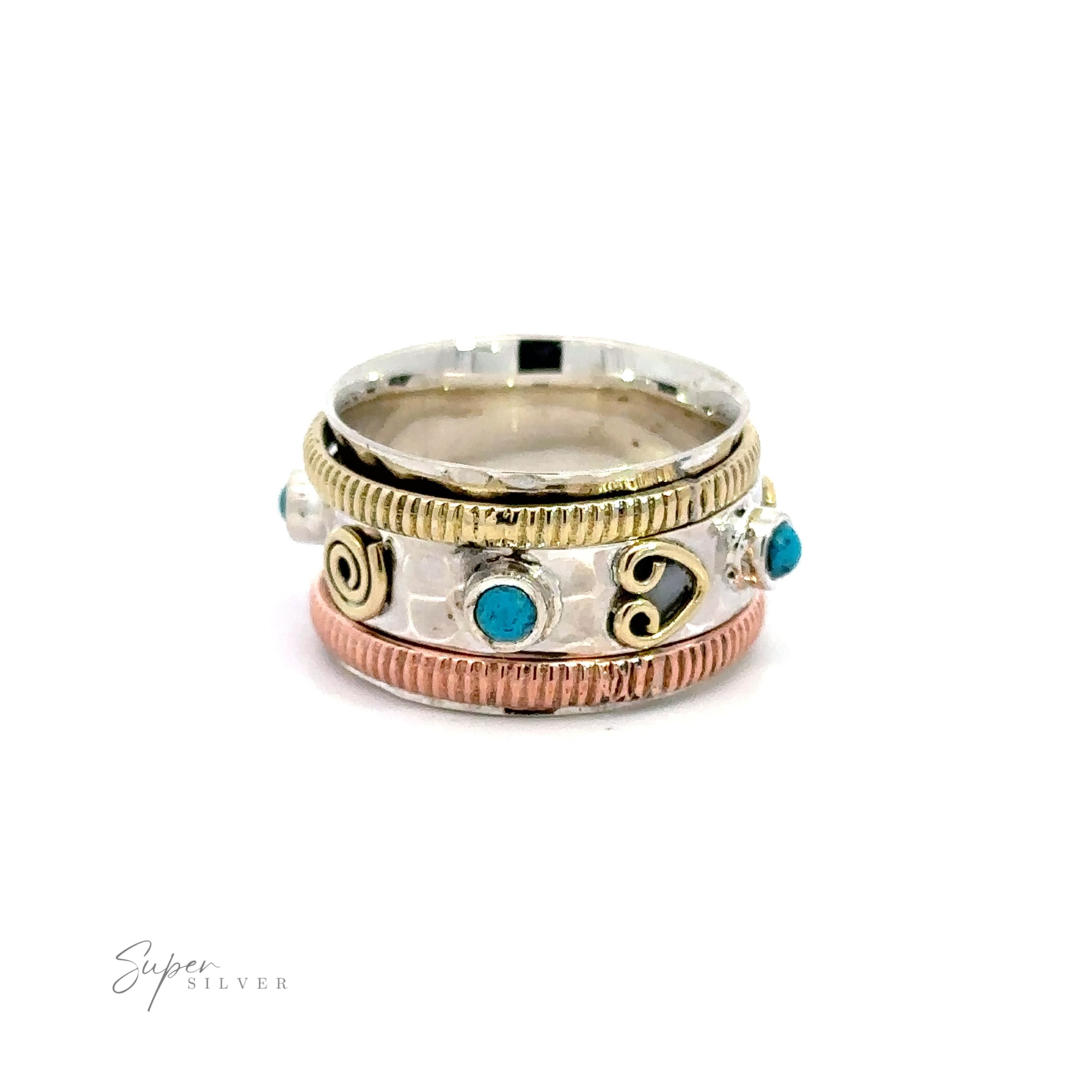 A stack of Handmade Tricolor Turquoise Spinner Rings with silver accents.