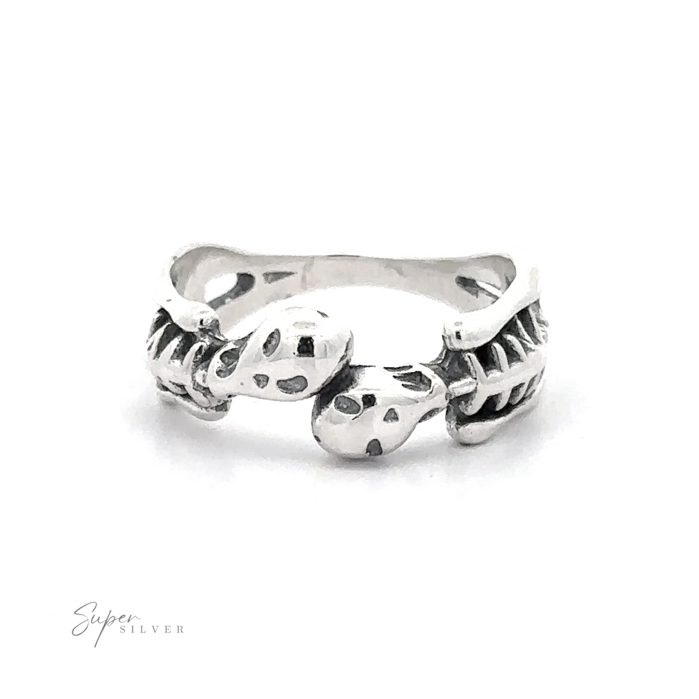 
                  
                    Skeleton Ring crafted from .925 Sterling Silver featuring a skeleton hand design with detailed bones and joints, displayed against a white background.
                  
                