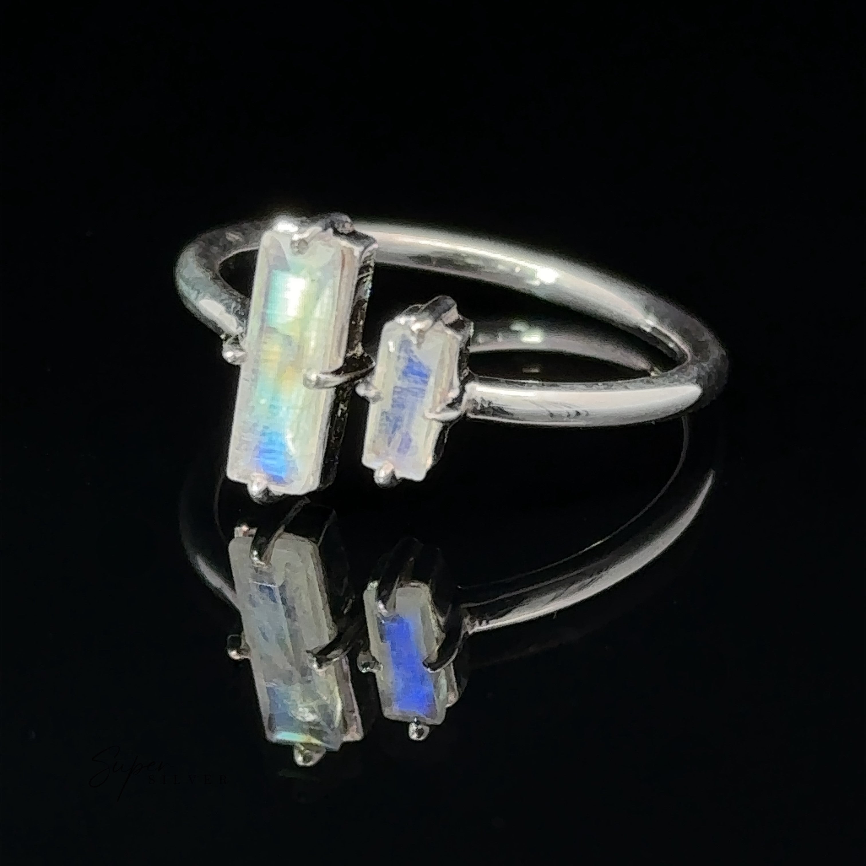 Online Only Exclusive Adjustable Crystal Ring displayed on a reflective black surface.