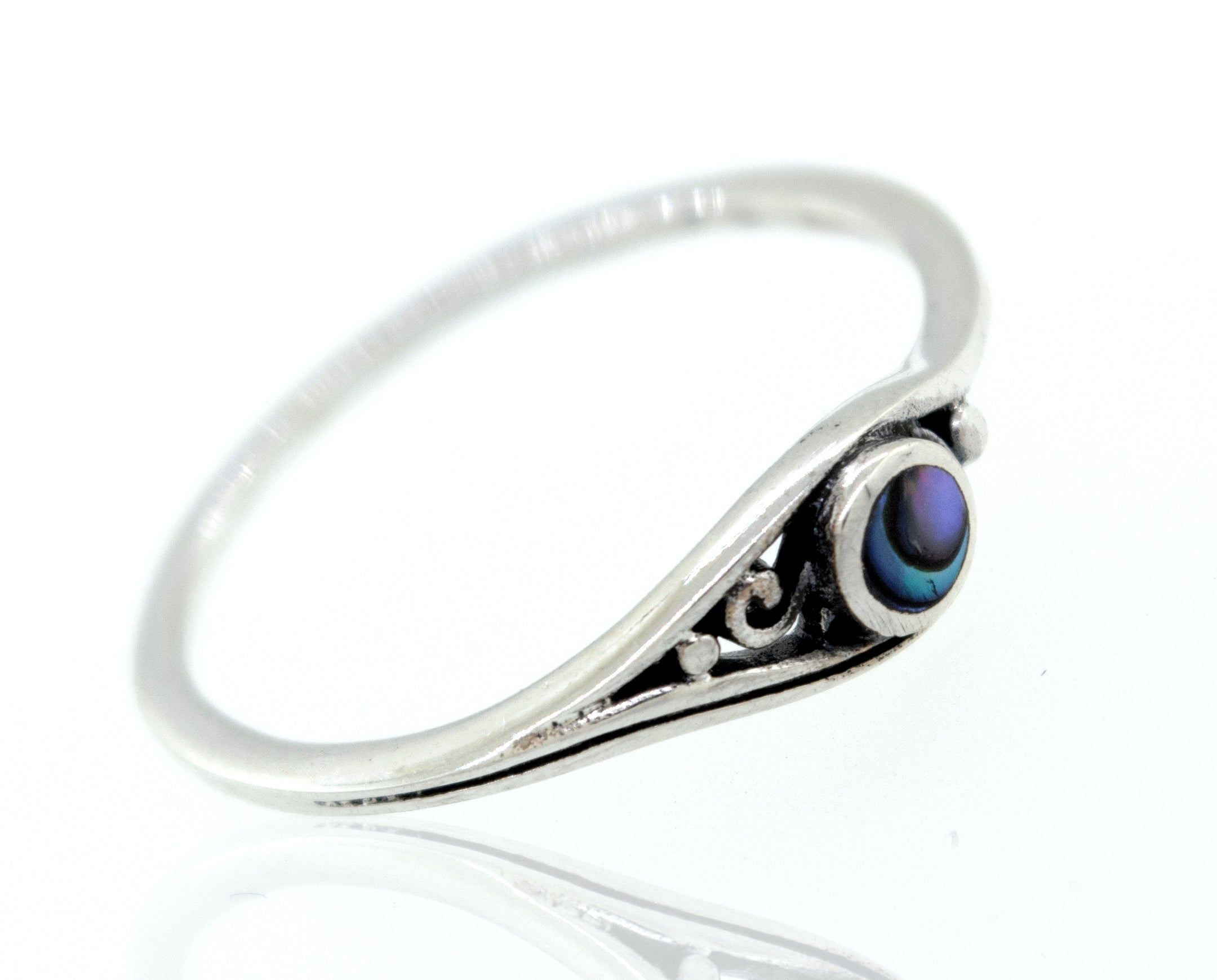 A sterling silver ring with the Delicate Inlay Stone Ring with Small Swirl Design.