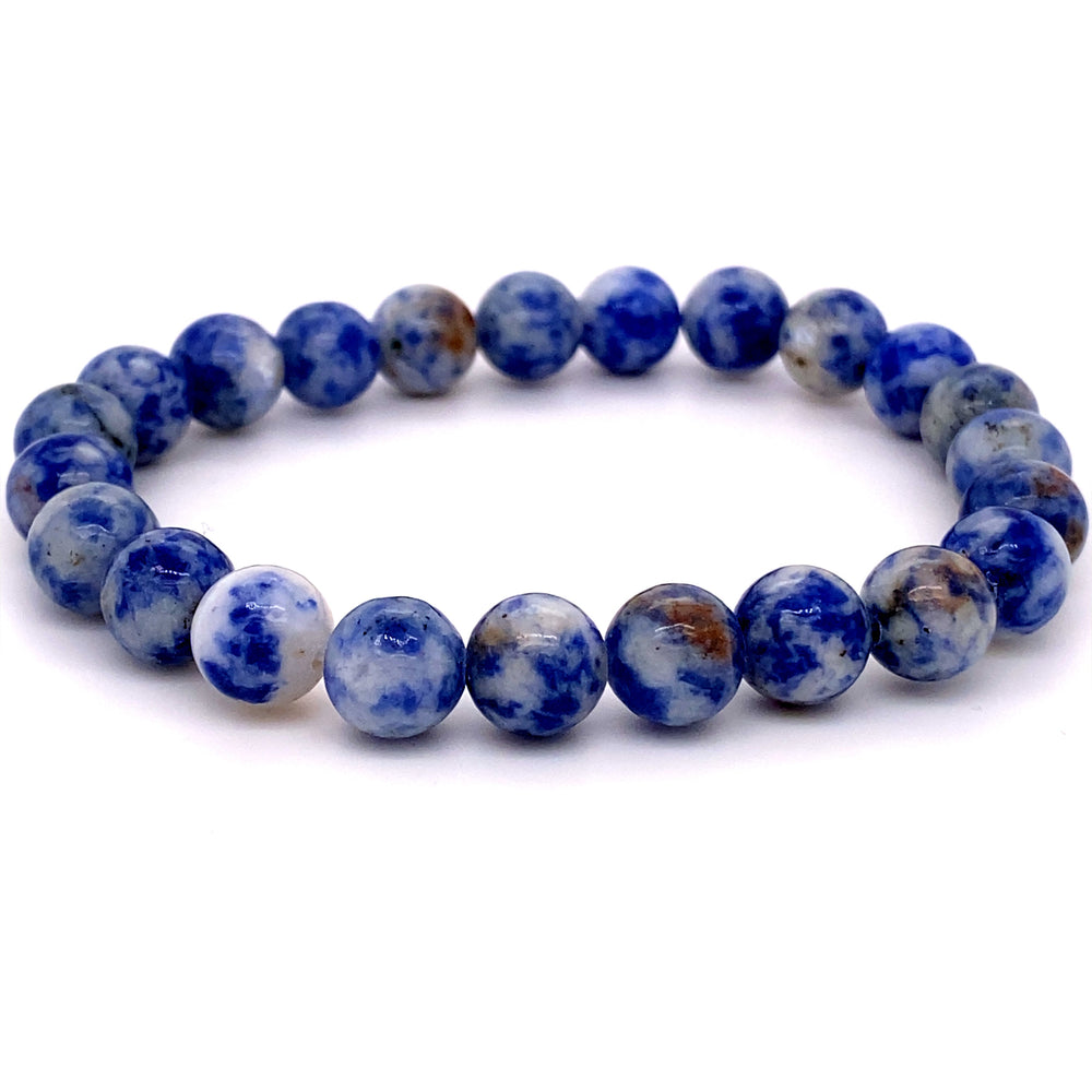 
                  
                    A 4mm beaded stone bracelet made of round sodalite beads, a known healing stone, with rich blue and mottled white and brown patterns, displayed on a white background.
                  
                