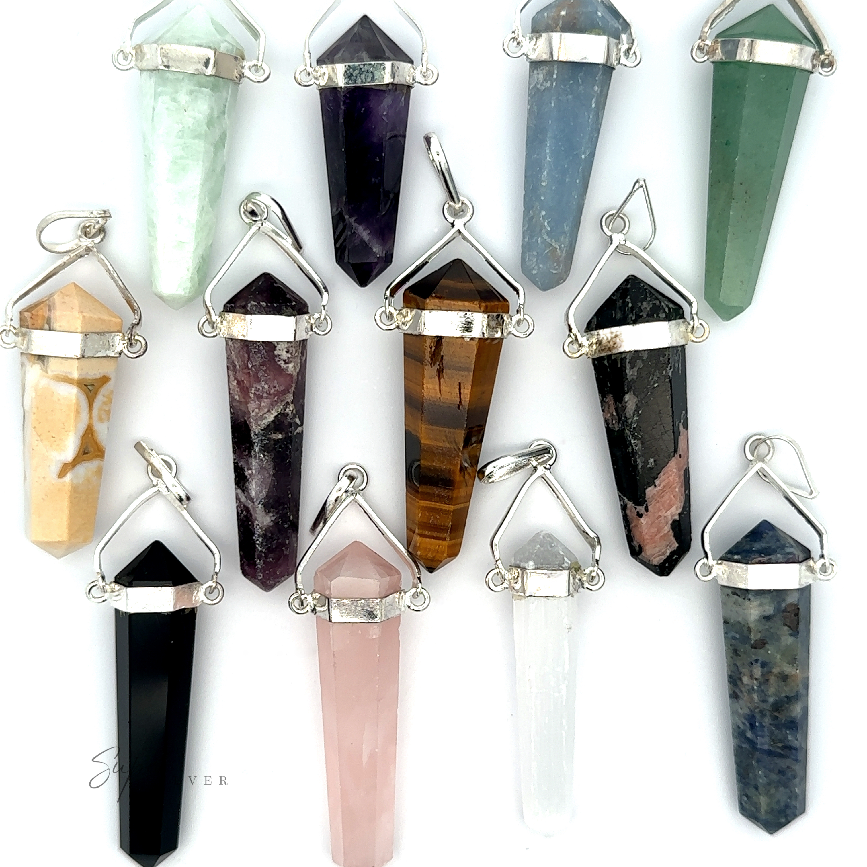 A dozen Raw Stone Swivel Pendants, featuring vibrant crystal designs set in silver-plated frames with chain loops, resembling raw stone obelisks, are arranged on a pristine white background.