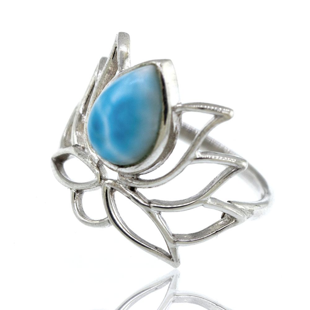 
                  
                    Online Exclusive Teardrop Stone Lotus Ring with a blue teardrop gemstone set in an abstract, leafy design, displayed against a white background.
                  
                