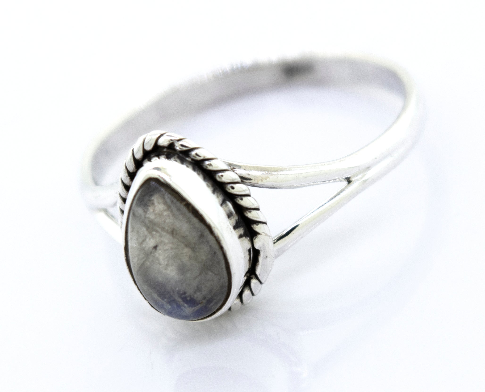 Vibrant Teardrop Shape Stone Ring with an oval gray gemstone set in a decorative bezel, displayed on a white background.