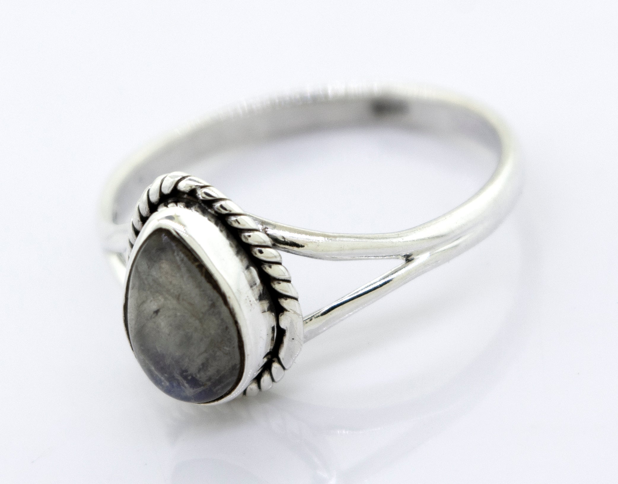 Vibrant Teardrop Shape Stone Ring with a teardrop-shaped grey stone set in a detailed bezel, against a white background.