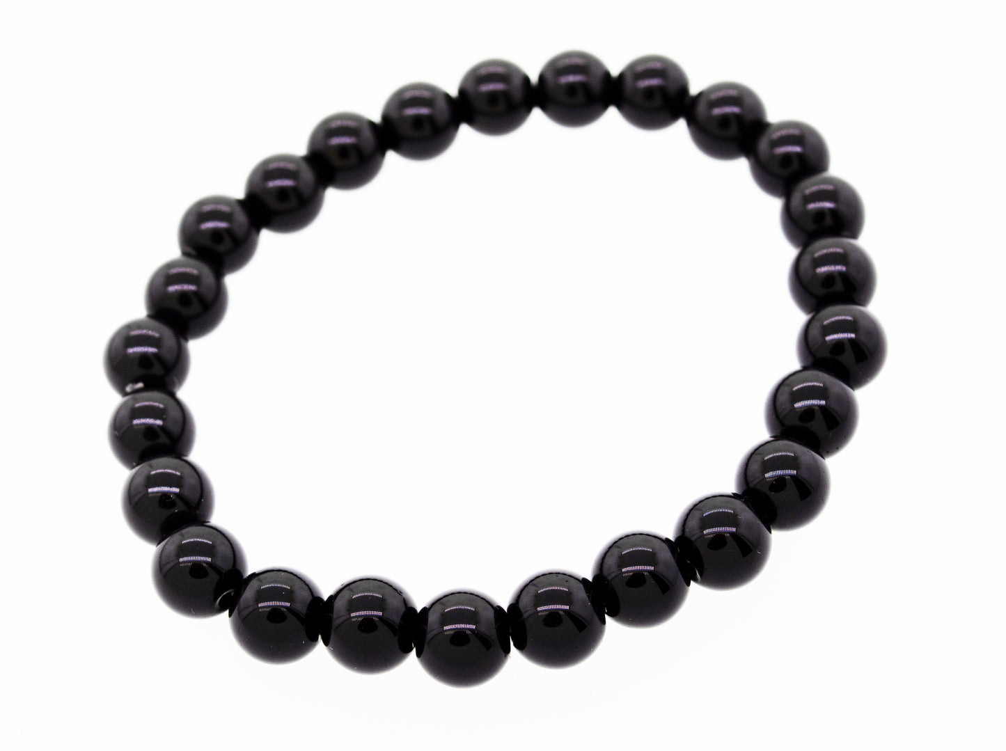 
                  
                    A black 4mm beaded healing stone bracelet arranged in a circle, displayed on a white background.
                  
                
