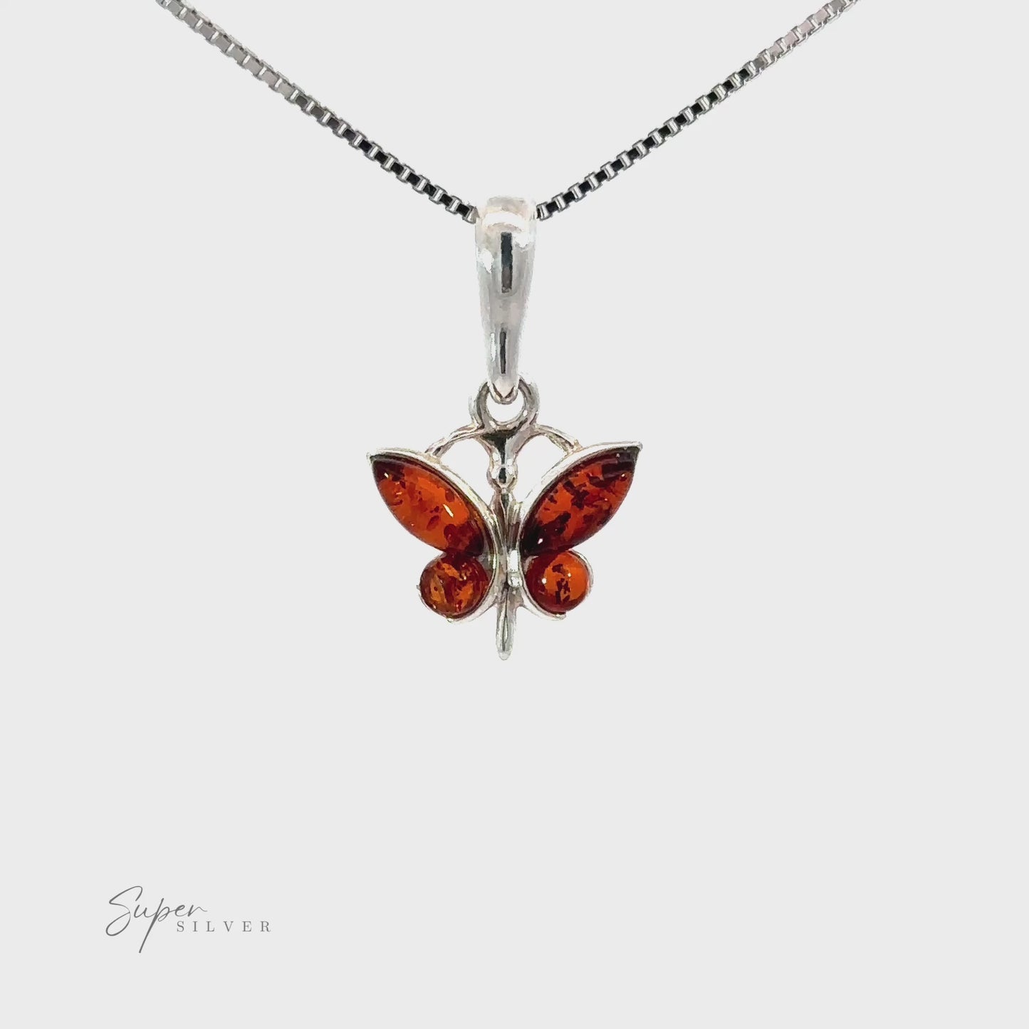 
                  
                    Load and play video in Gallery viewer, Small Amber Butterfly Pendants
                  
                